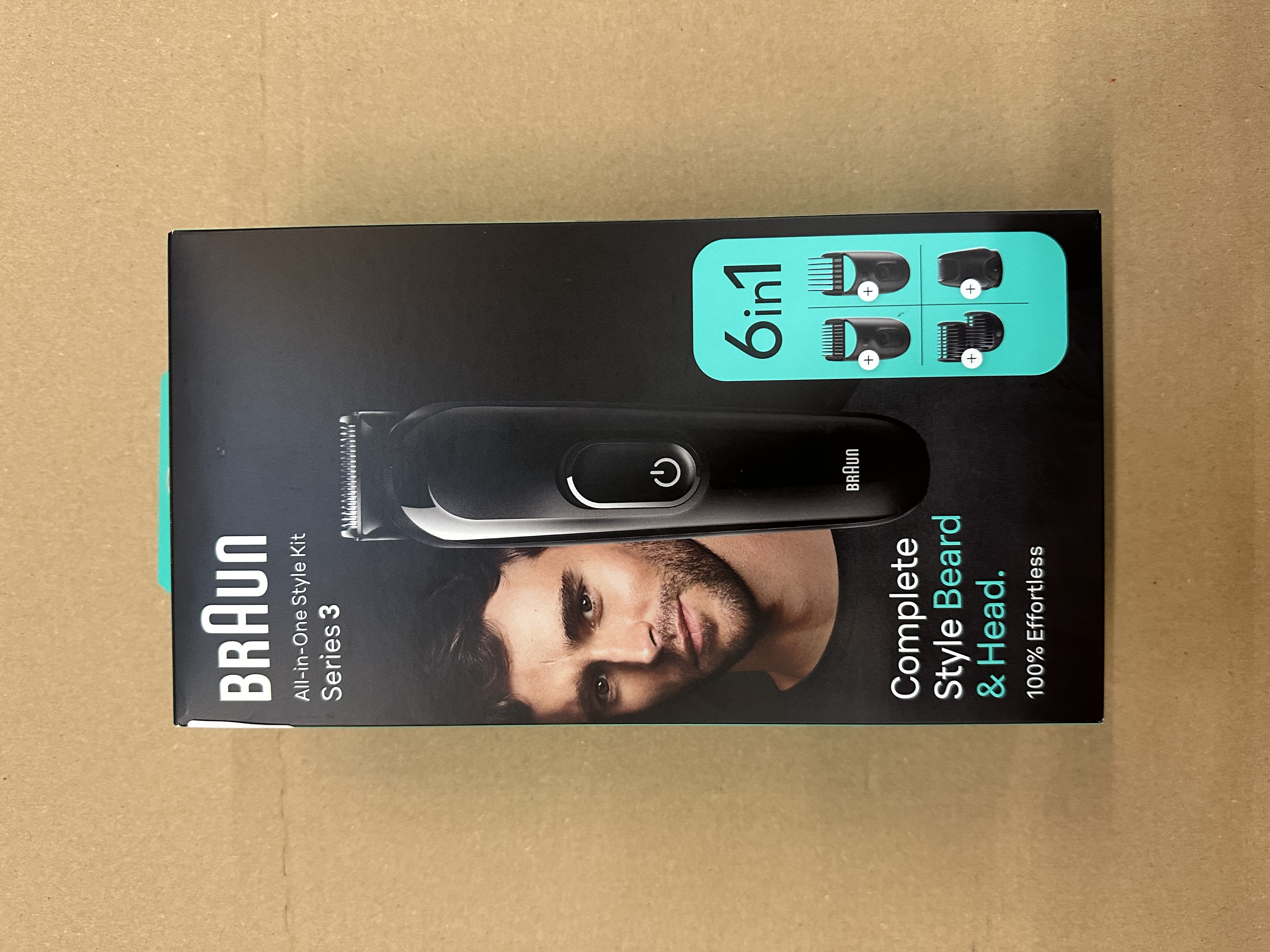 Pudełko Braun All-in-One Style Kit, czarne, z twarzą mężczyzny i obrazami.