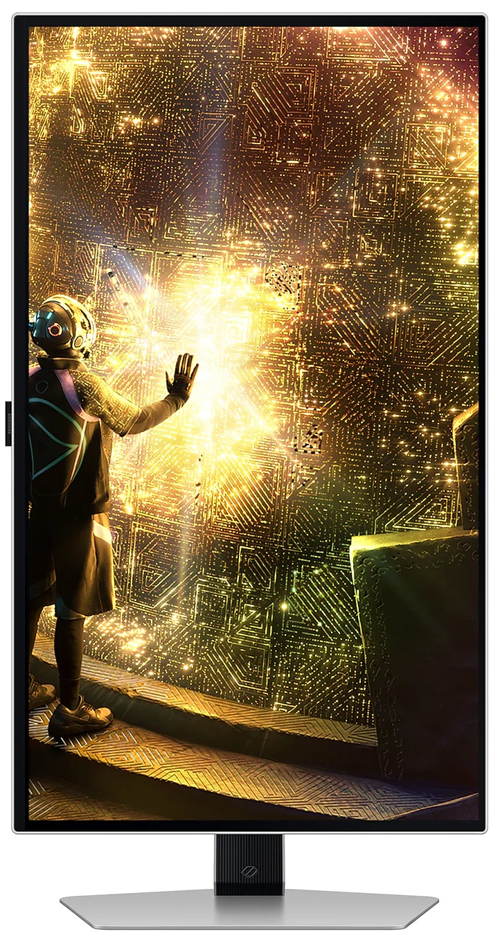 Srebrny laptop z jasnoniebieskim ekranem pokazującym interfejs systemu Windows 11.