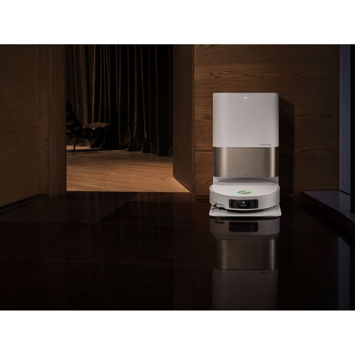 Robot vacuum cleaner on a charging station. The room has dark wood and a polished floor.