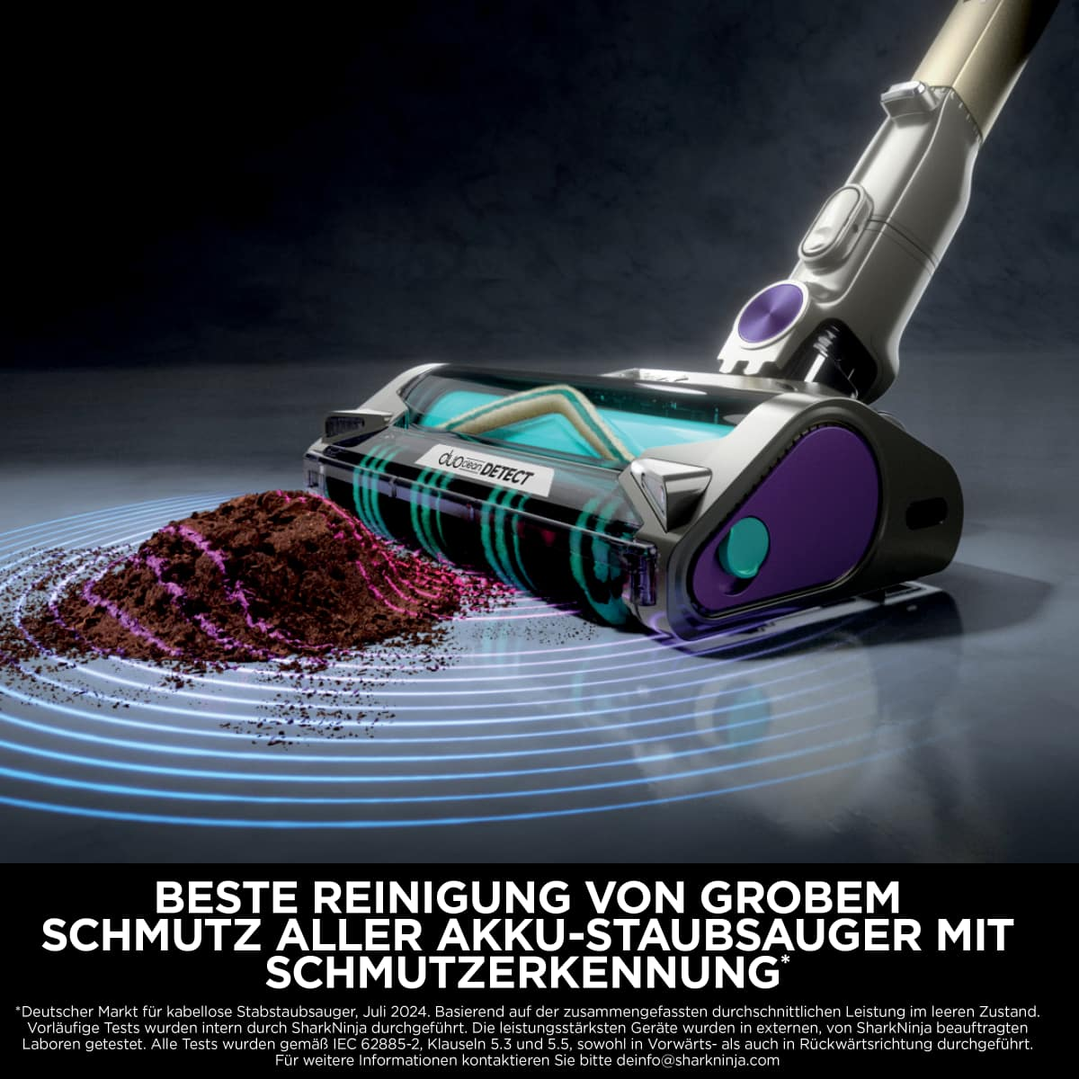 Ein Staubsauger reinigt Schmutz auf dem Boden. Lila und türkis Bürstenkopf.