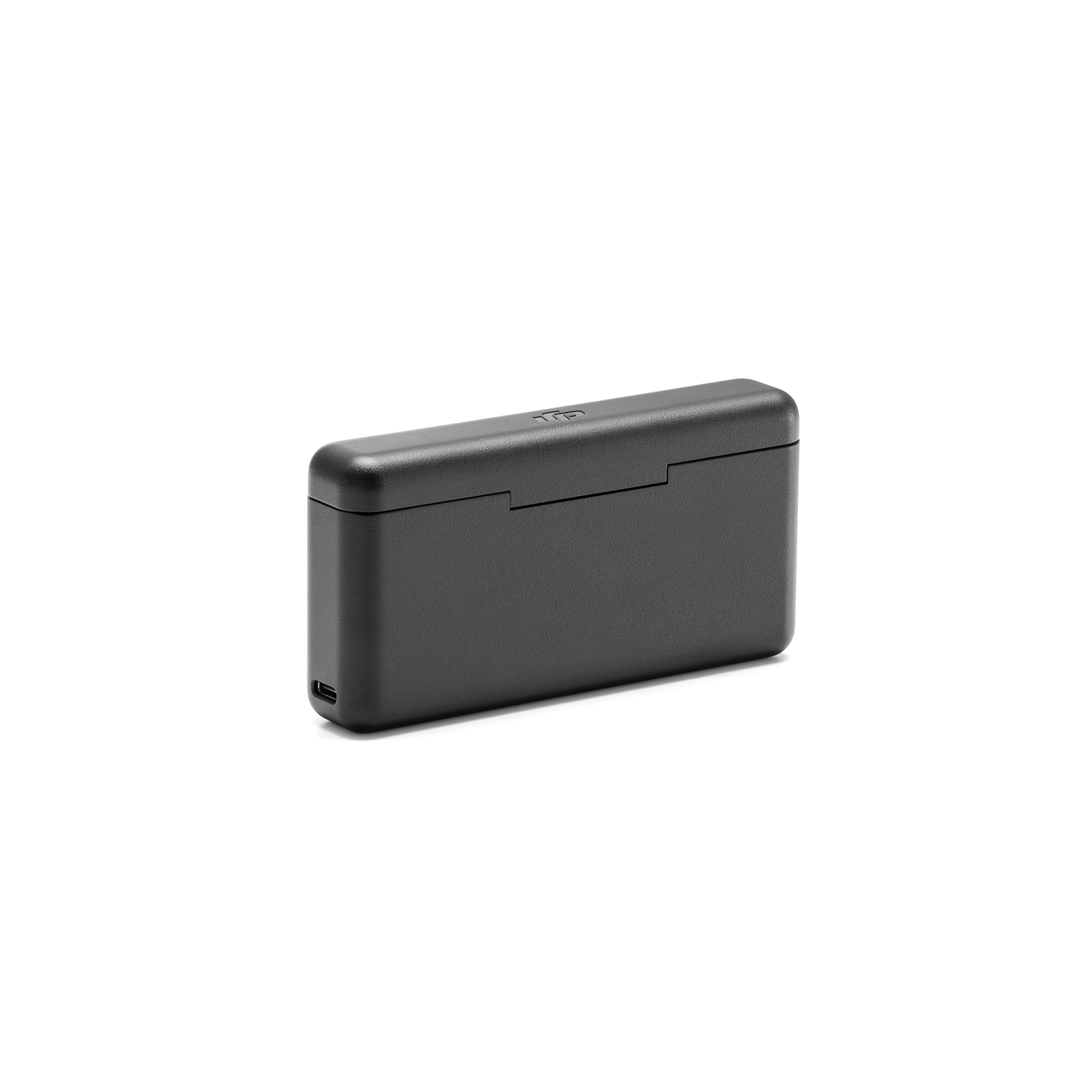 Étui de chargement noir. Forme rectangulaire. L'étui est posé sur une surface blanche.