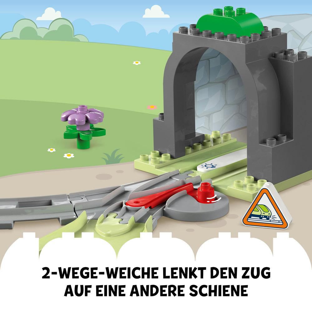 Ein Lego-Zugset mit Tunnel, Gleisen und einem Signal.