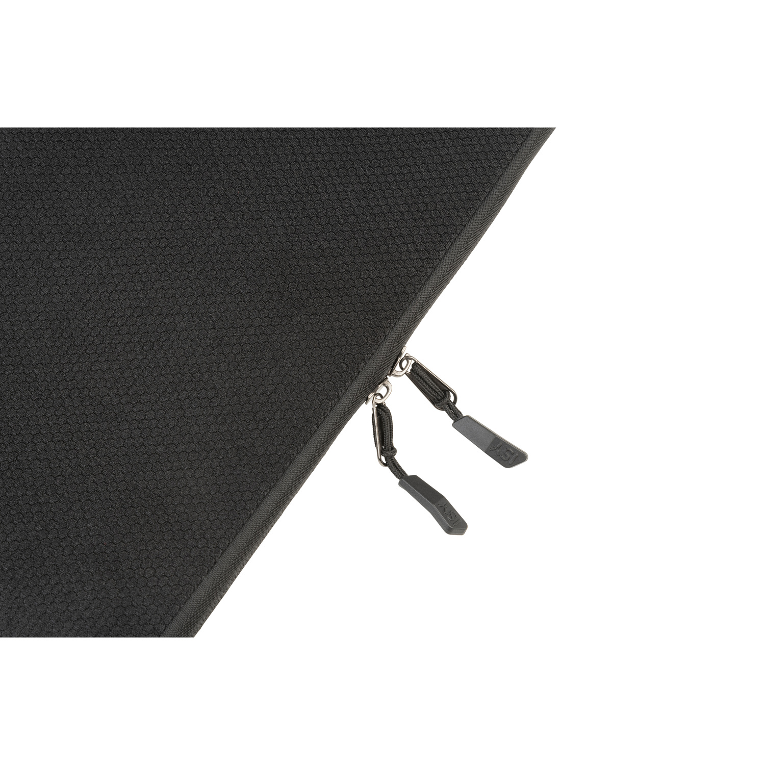 Close-up of black material with zippers. Zippers have black pulls with white text.