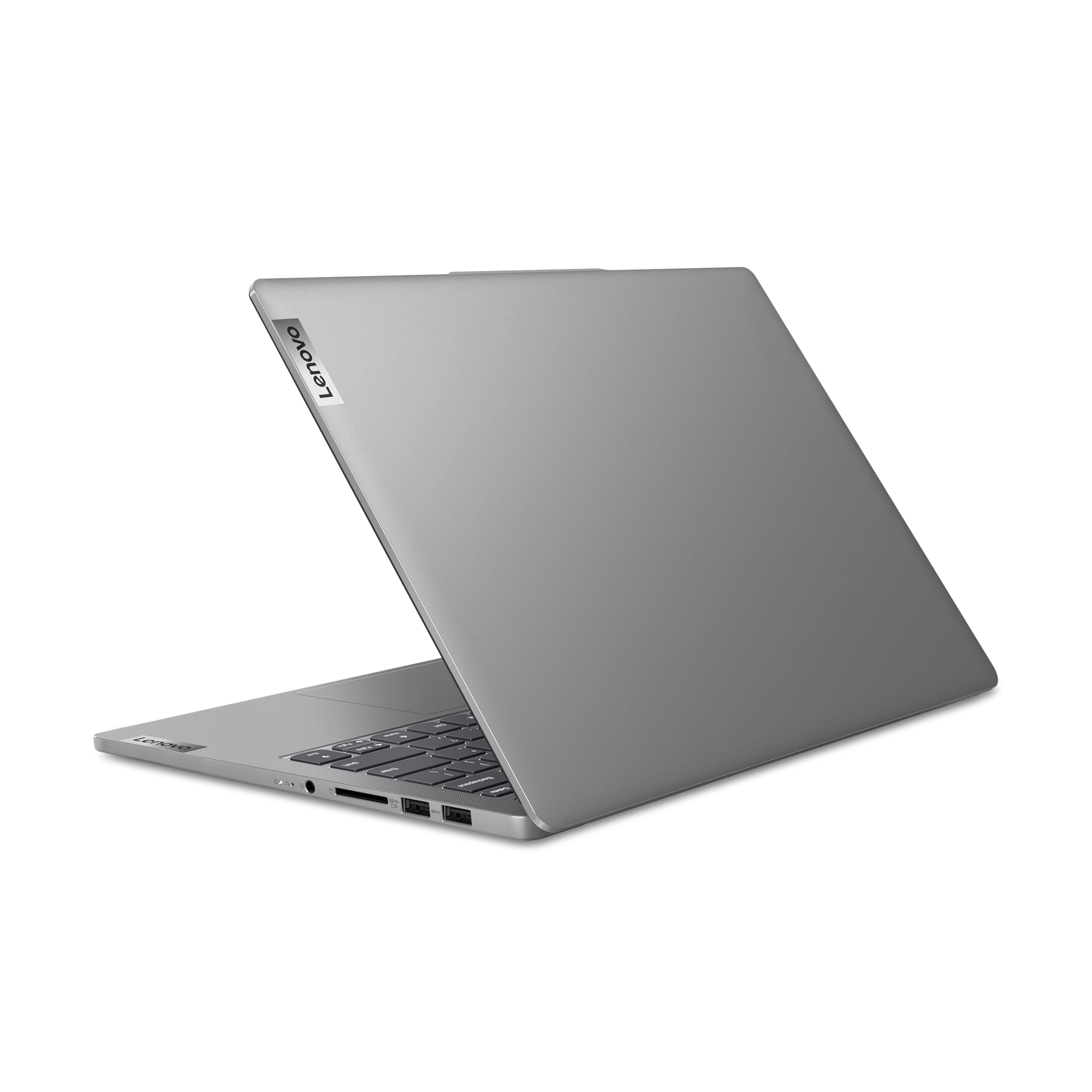 Gümüş dizüstü bilgisayar, kapalı, siyah arka plan üzerinde. Lenovo logosu görünür. Dizüstü bilgisayarın arkası.