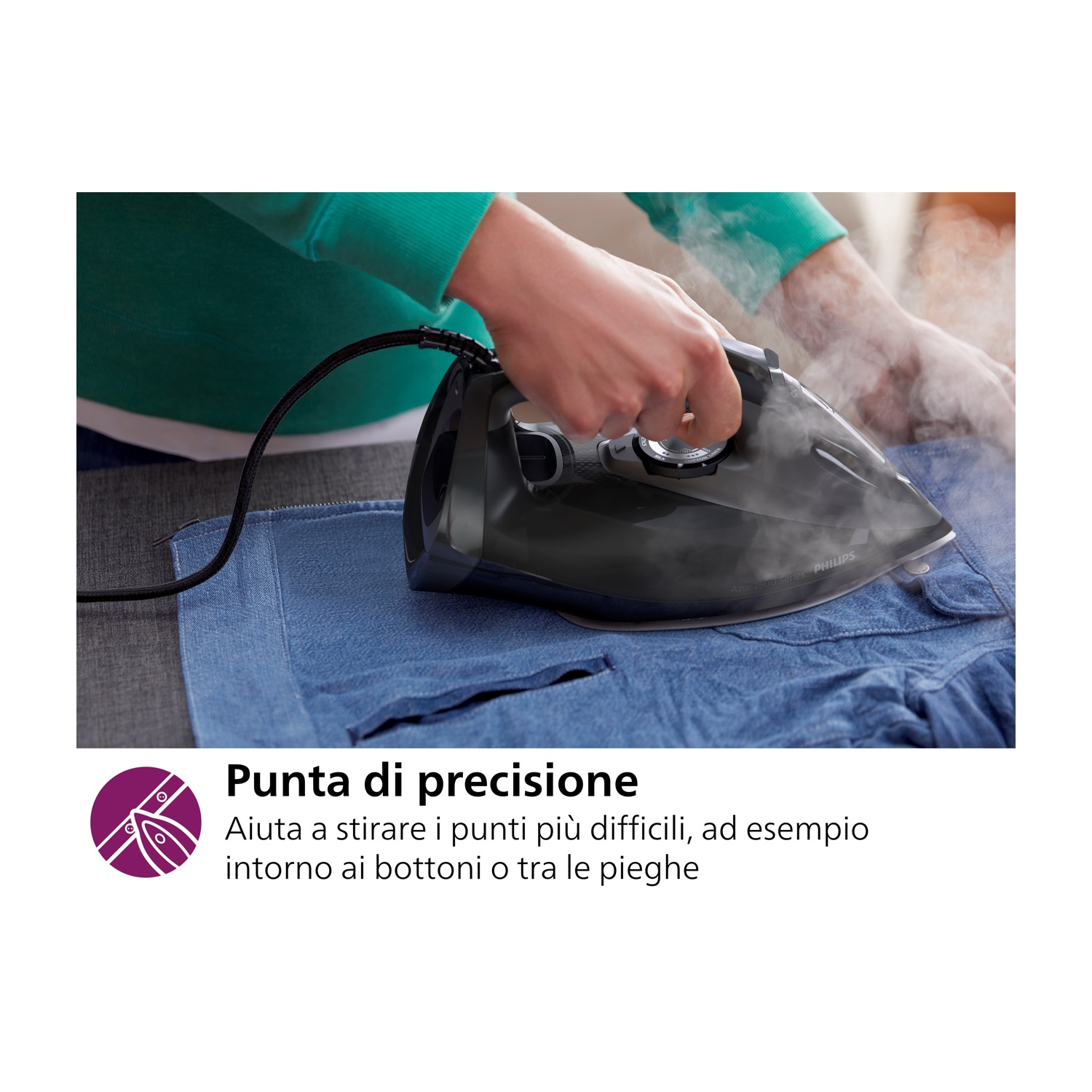 Una persona che stira una camicia blu con un ferro Philips, vapore che sale.