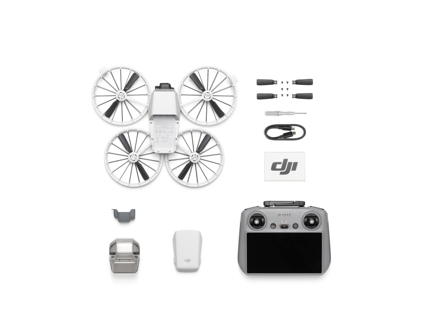 Componentes de dron, incluyendo un mando, hélices y batería.