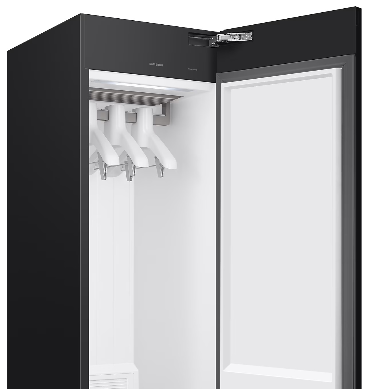 Czarna szafa z otwartymi drzwiami, wnętrze z białymi detalami.