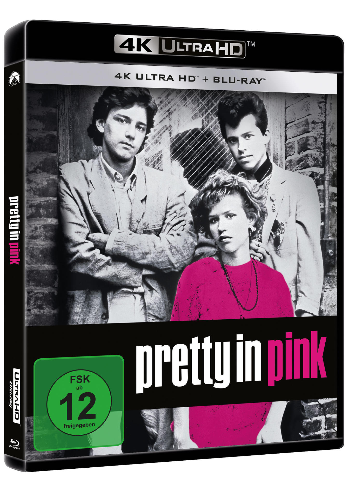 DVD-Cover von 'Pretty in Pink', mit Schauspielern vor einer Backsteinmauer. FSK 12-Bewertung.
