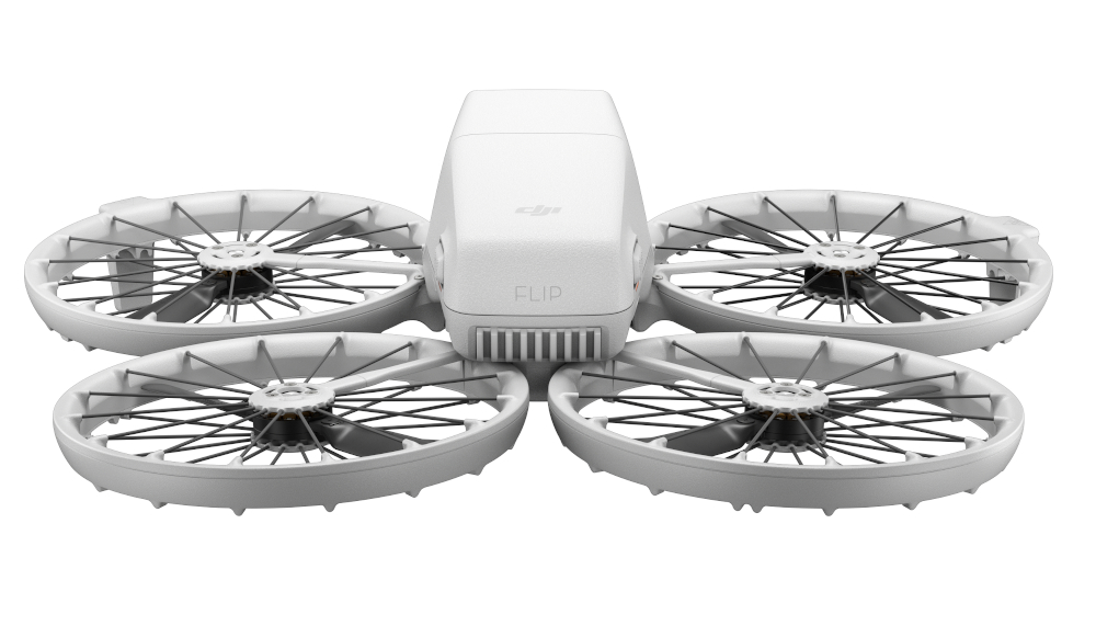 Biały dron z czterema śmigłami, słowo "FLIP" na górnej powierzchni.