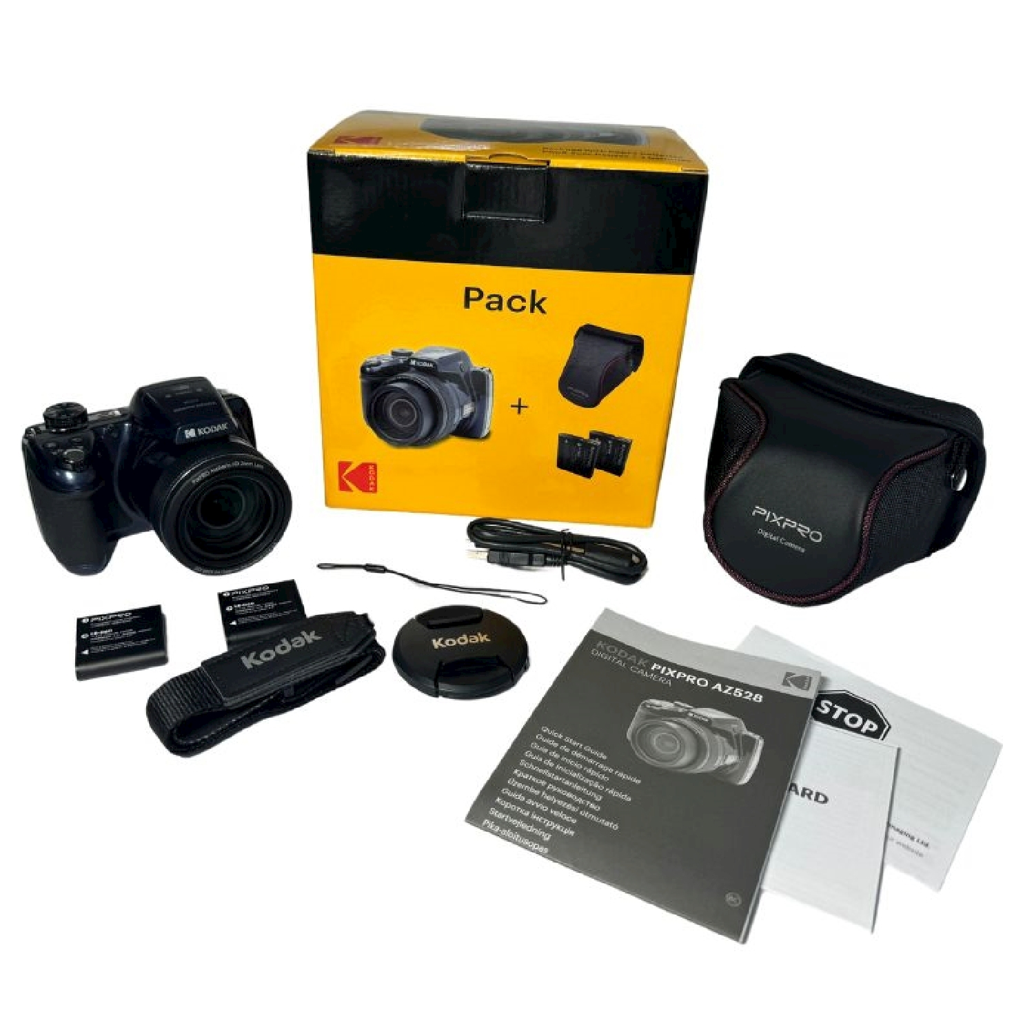 Una fotocamera con accessori, in una scatola e disposti.