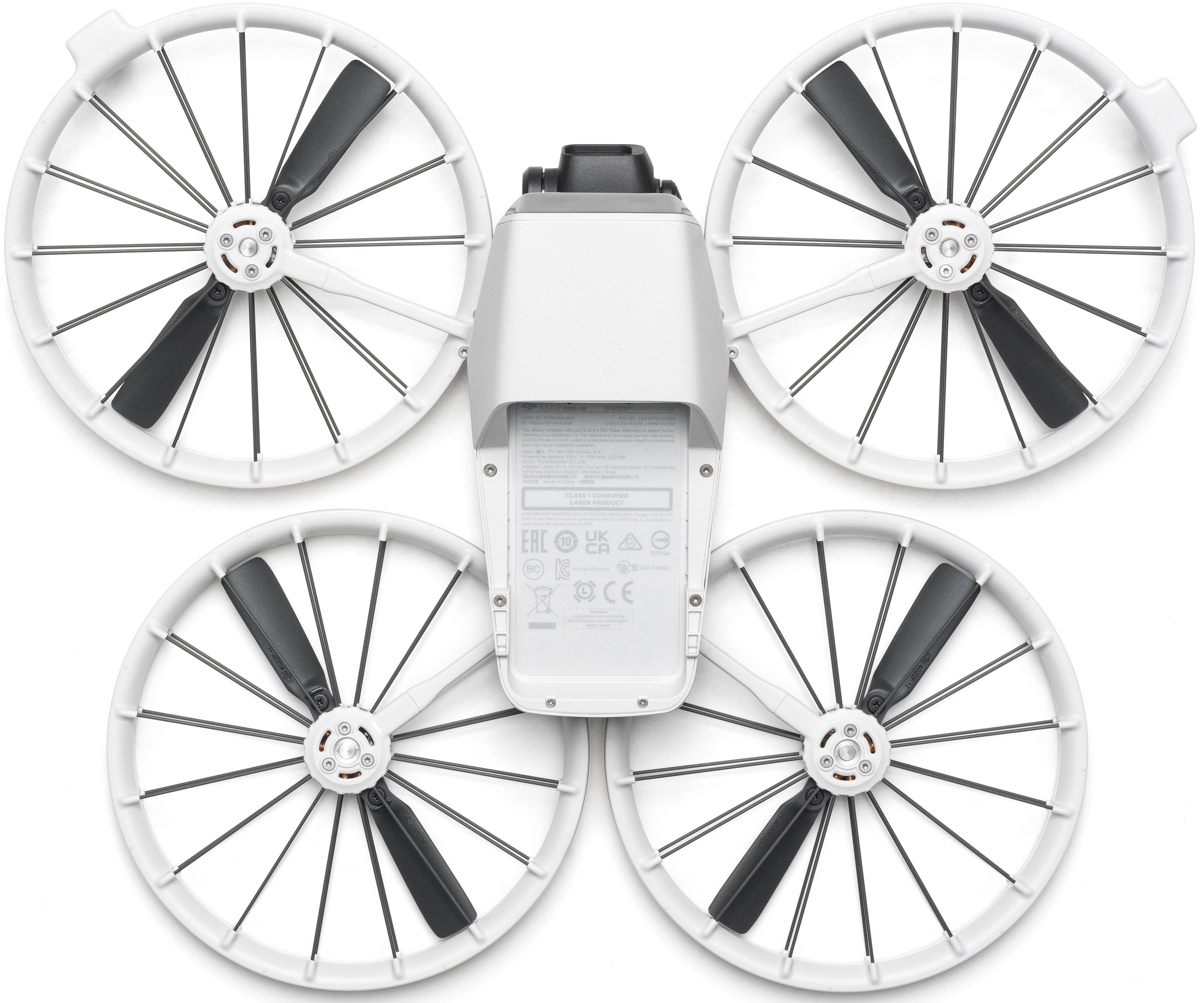 Drone bianco con quattro eliche. Il vano batteria è visibile.