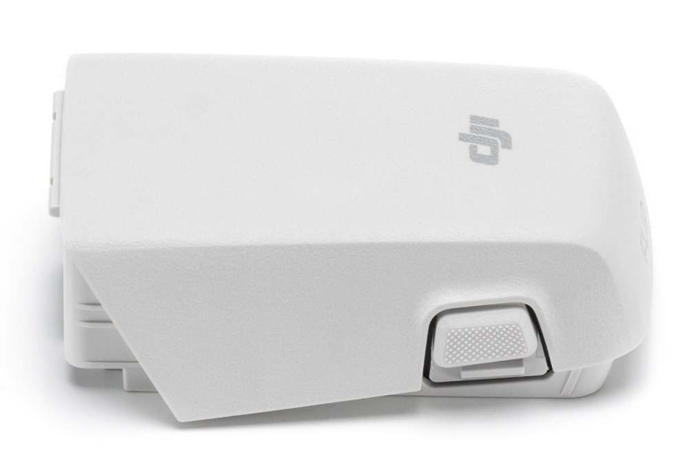 Biała bateria drona z przyciskiem i logo. Górna powierzchnia jest lekko zakrzywiona. Na białej powierzchni.