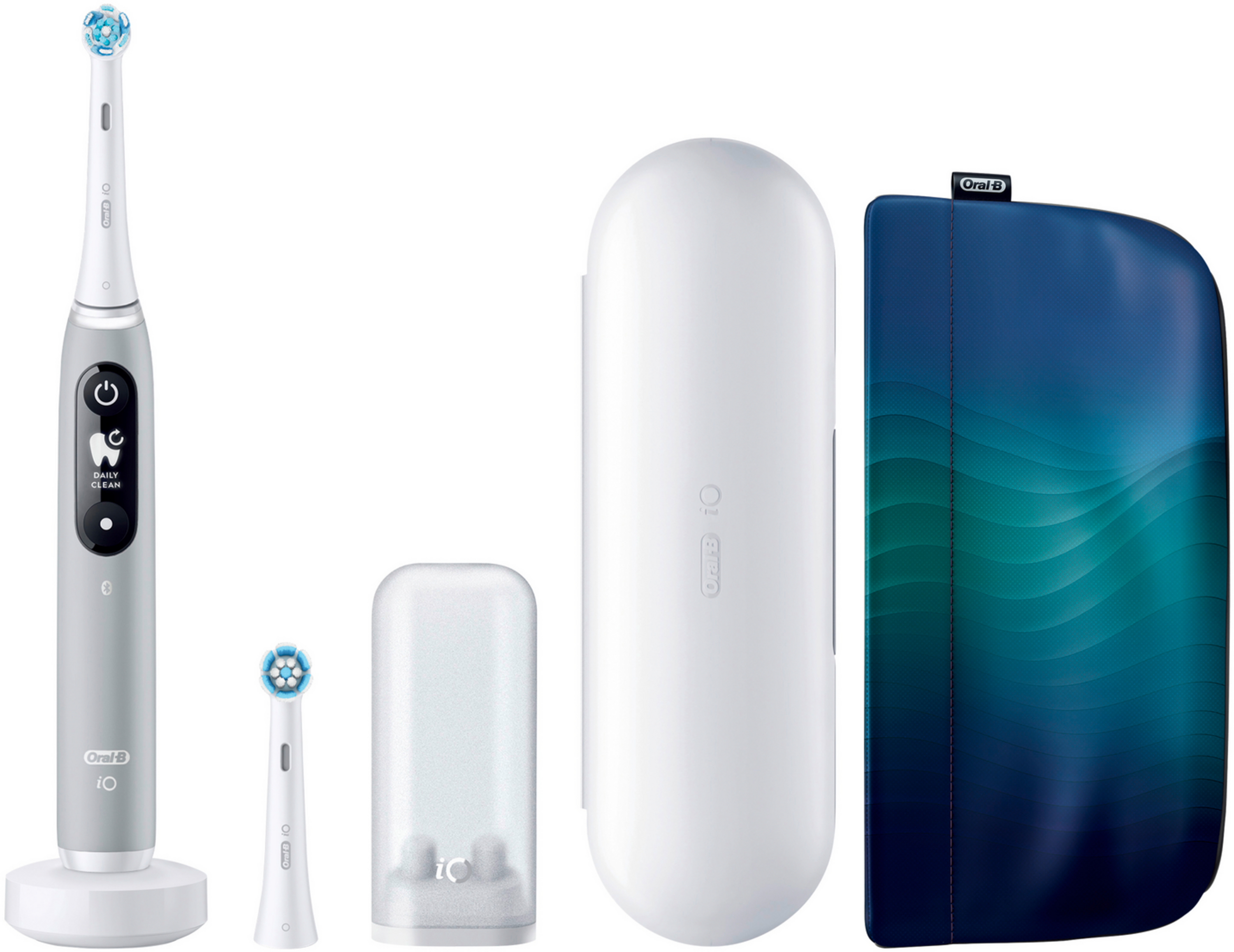 Graue Oral-B iO Zahnbürste, Ladestation, Bürstenköpfe, weiße Reisehülle und blaue Reisehülle.