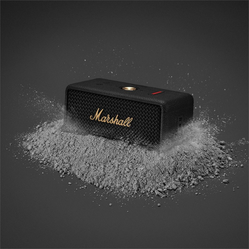 Schwarzer Marshall-Lautsprecher auf grauem Pulver, mit Spritzeffekt.