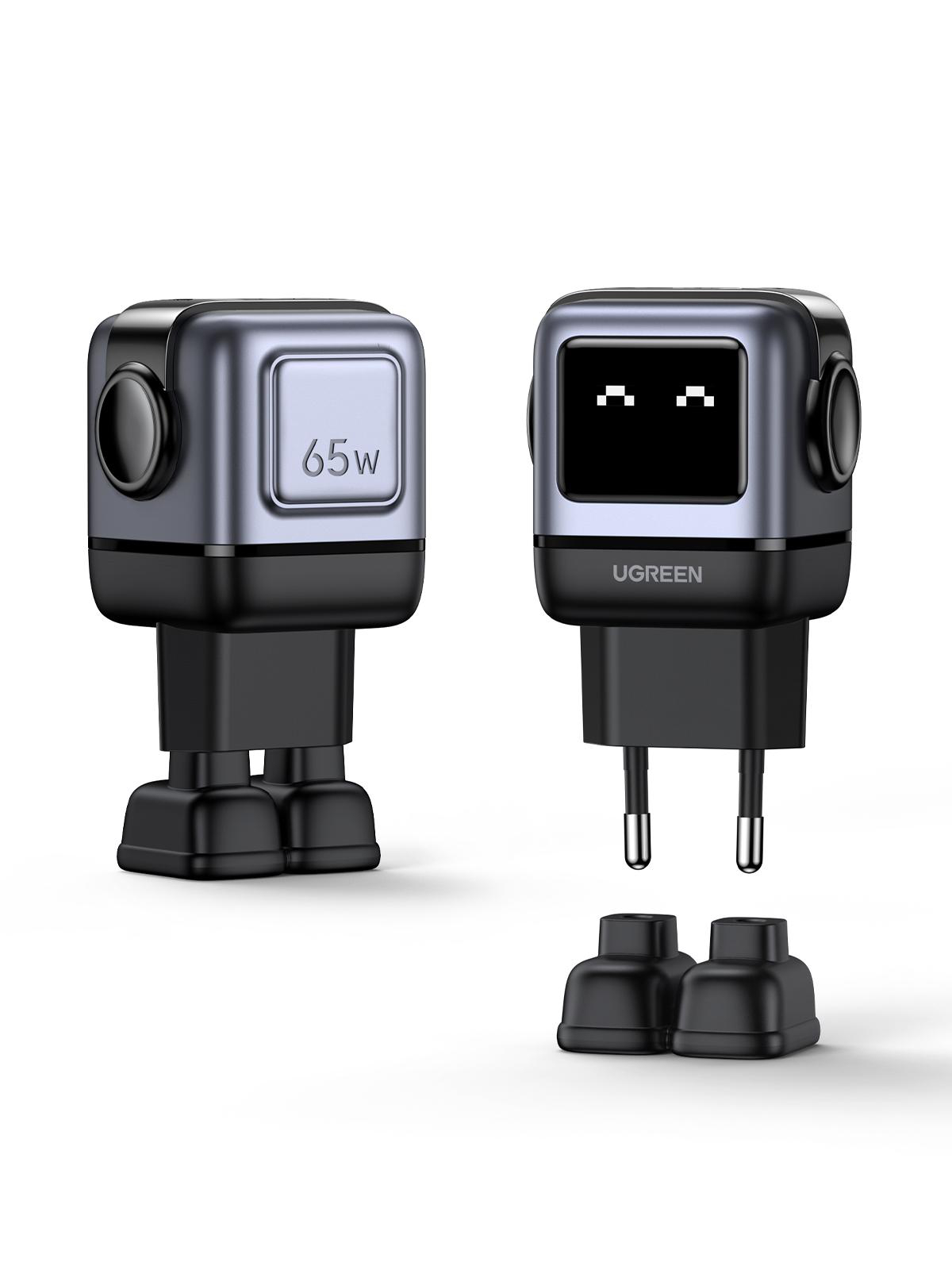 Zwei UGREEN Roboter-Ladegeräte. Eines zeigt '65W', das andere hat pixelige Augen und einen Stecker.