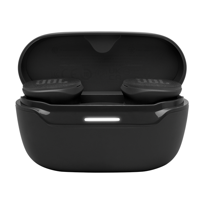 Auriculares JBL negros en un estuche de carga, con luz blanca.