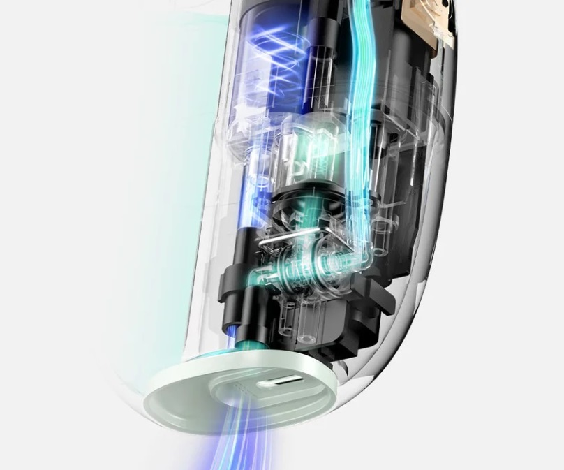 Wewnątrz irygatora, pokazujący mechanizm wewnętrzny z niebieskim przepływem wody.