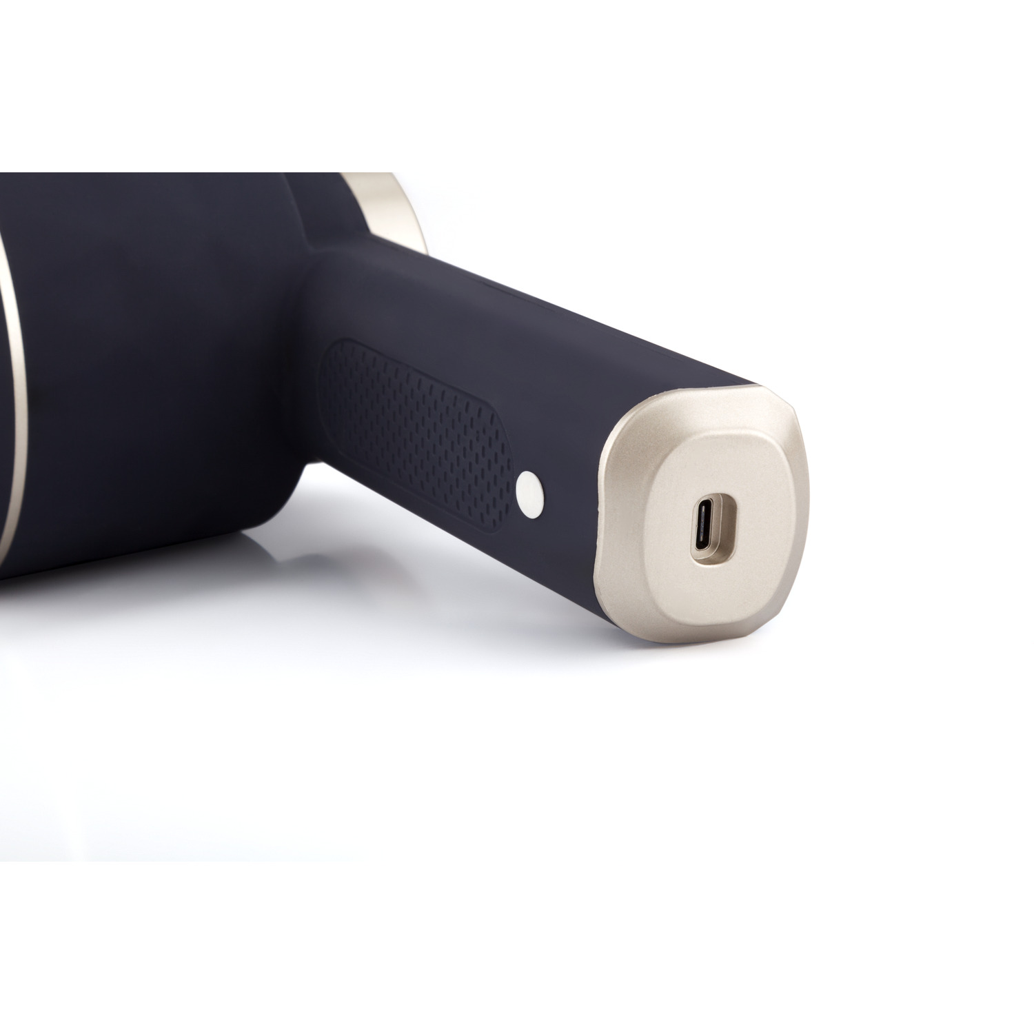 Close up of the base of a massage device. Silver and black colors.
