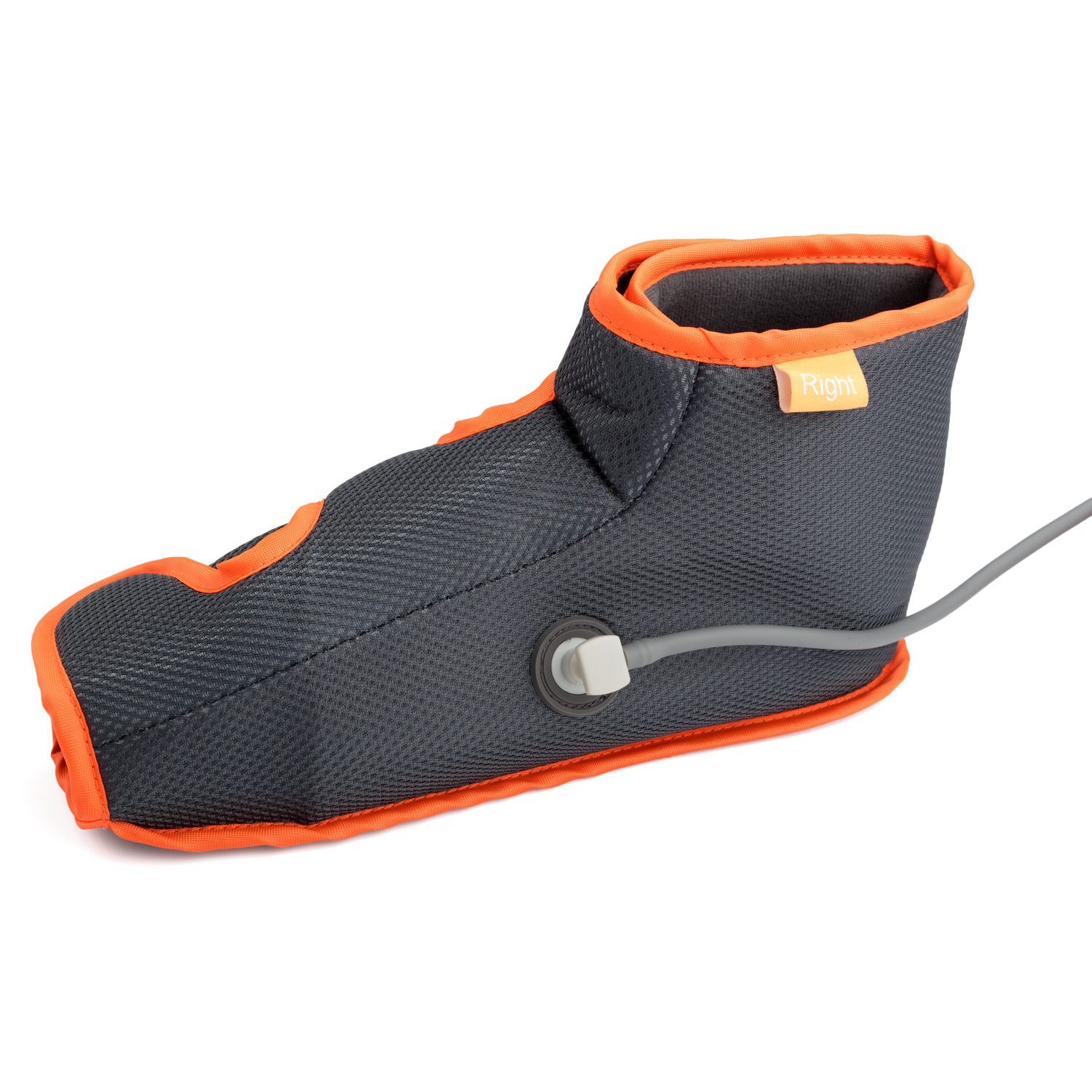 Black and orange medical boot for leg therapy, isolated on white background.