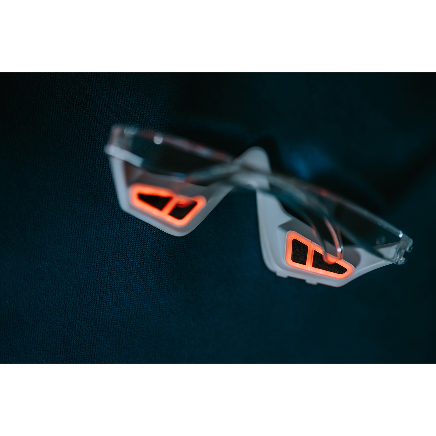 Close-up of cycling glasses with orange lenses.