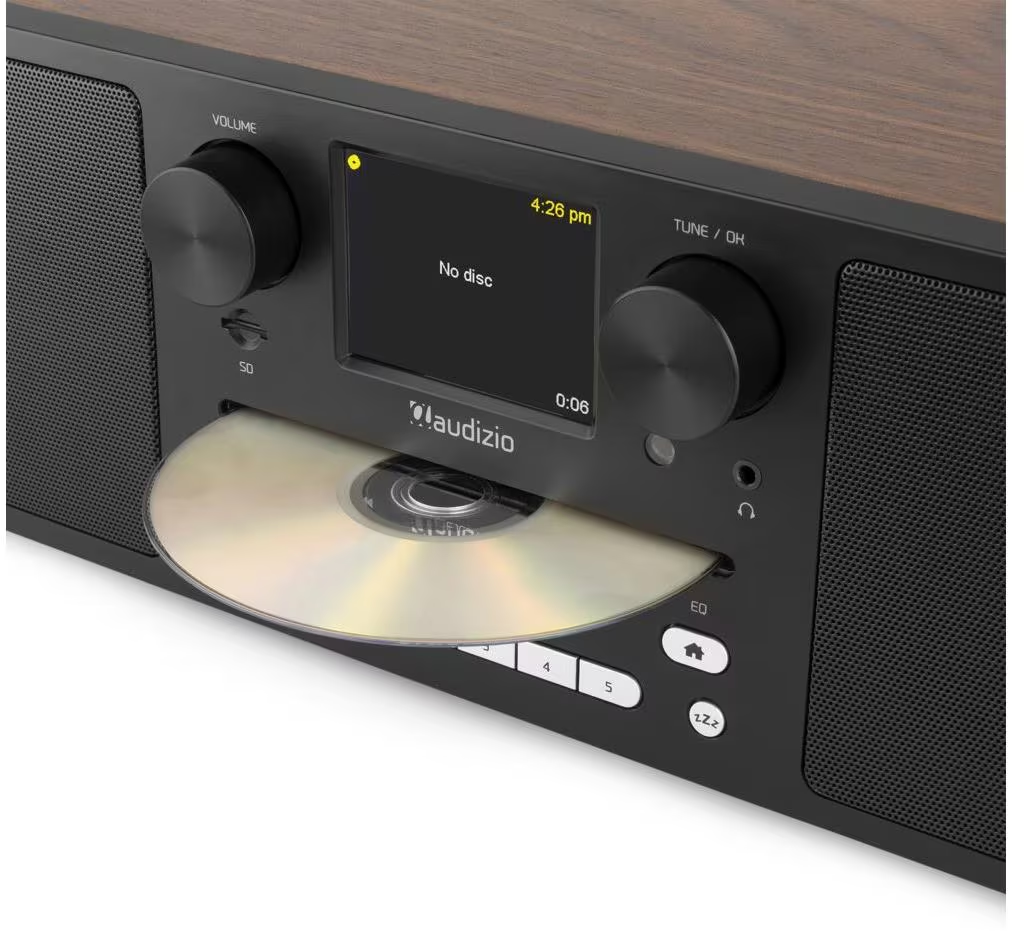 Radio in legno con CD in espulsione. Lo schermo mostra il messaggio 'No disc'.