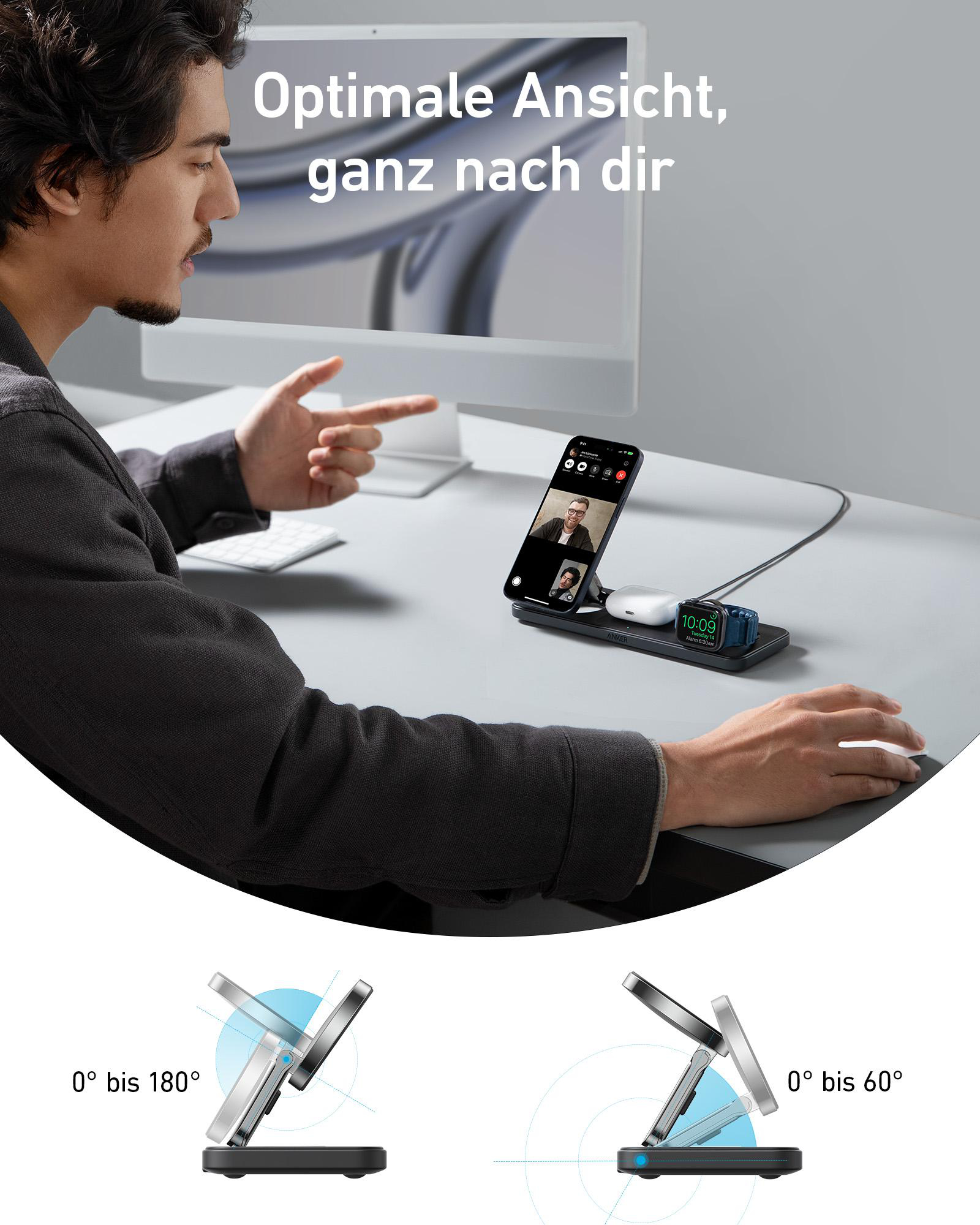 Ein Mann benutzt eine Ladestation mit Telefon und Uhr auf einem Schreibtisch, mit Computer.