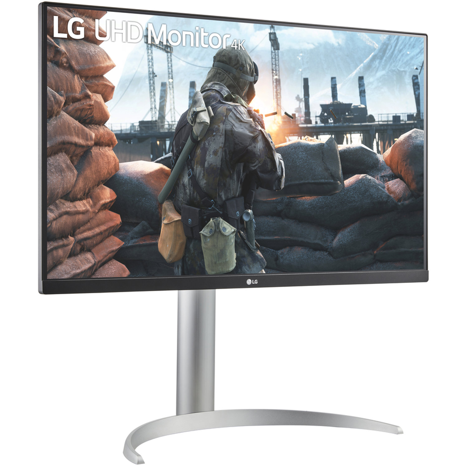 An LG monitor displays a war scene. A soldier is in focus. Sandbags are in the foreground, and a tower is in the background.