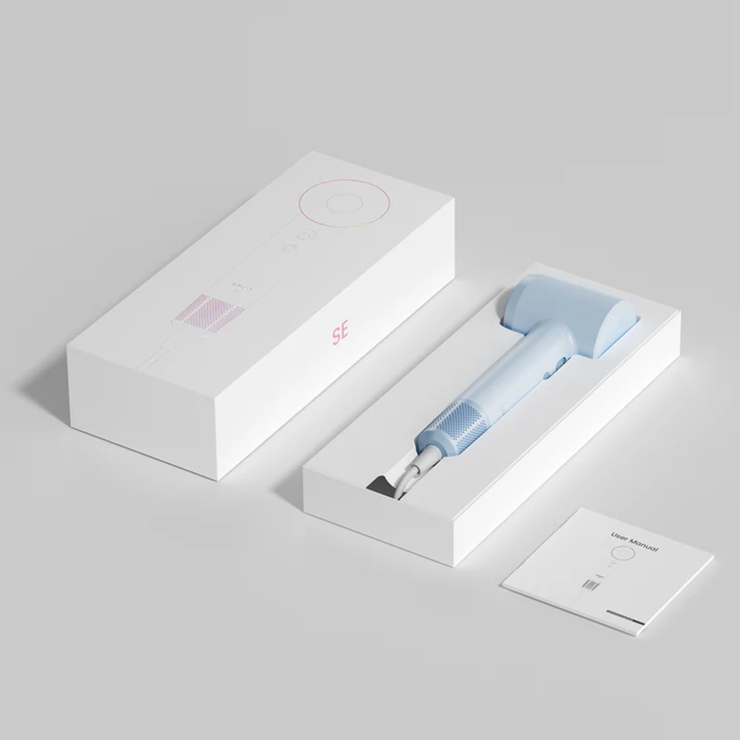 Scatole bianche con set di cacciaviti blu e bianco e manuale utente.