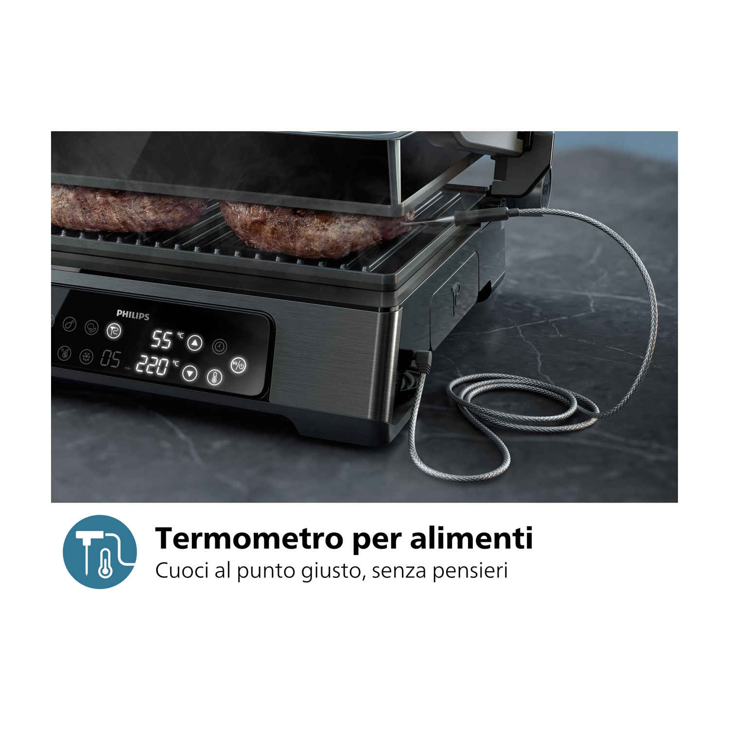 Primo piano della griglia da interno che cucina bistecche, con termometro e testo sovrapposto.