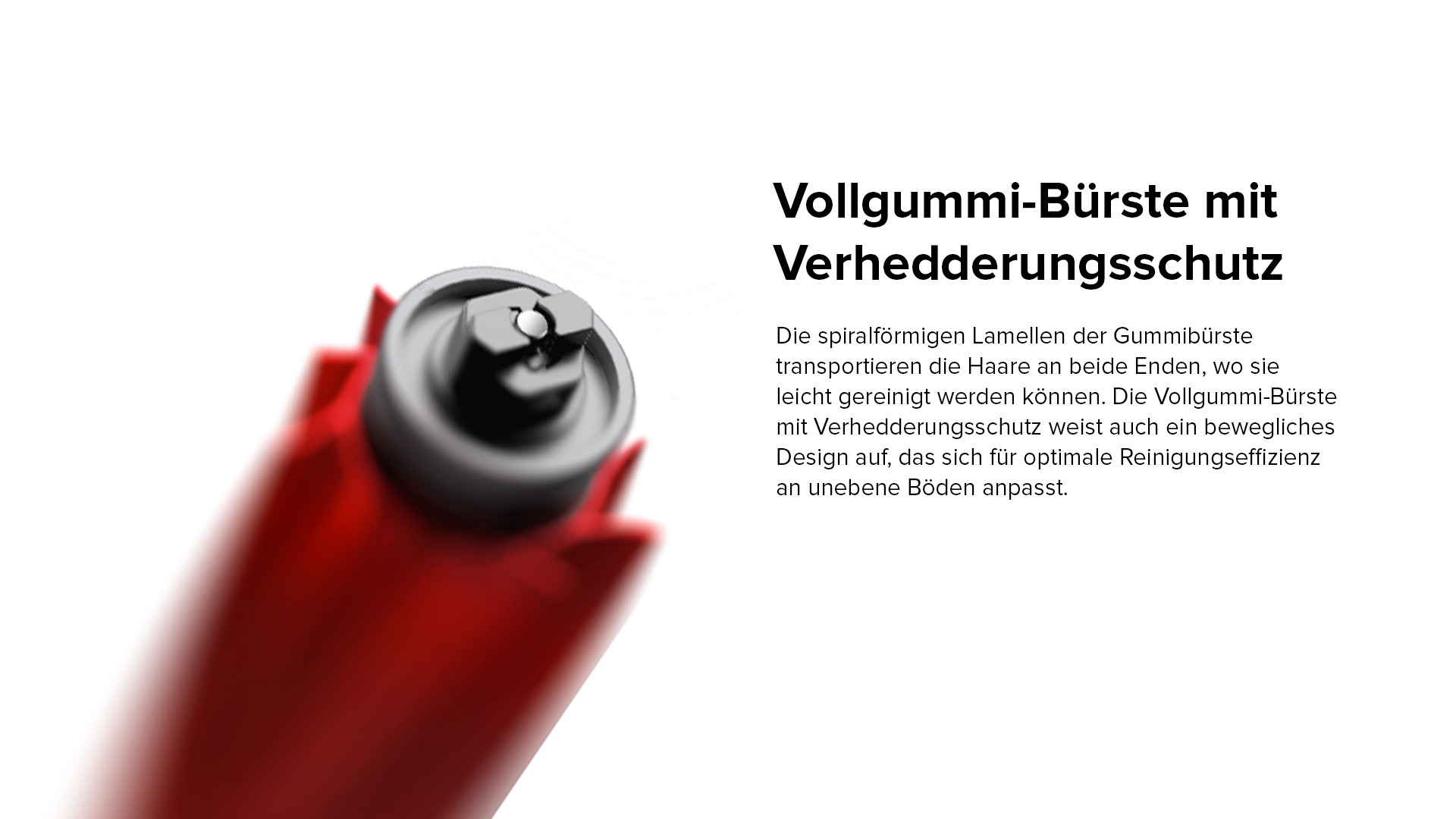 Nahaufnahme einer rot-schwarzen Walzenbürste eines Staubsaugers.