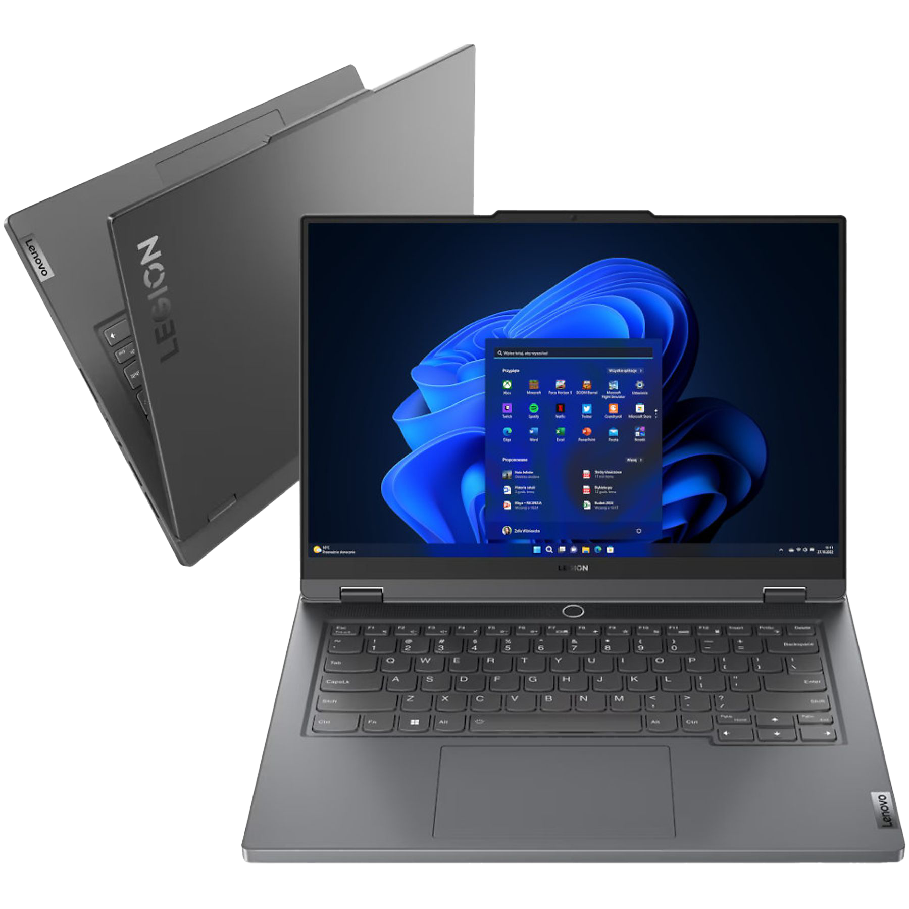 Ciemnoszary laptop, otwarty, z ekranem z ikonami aplikacji i innym widokiem laptopa.