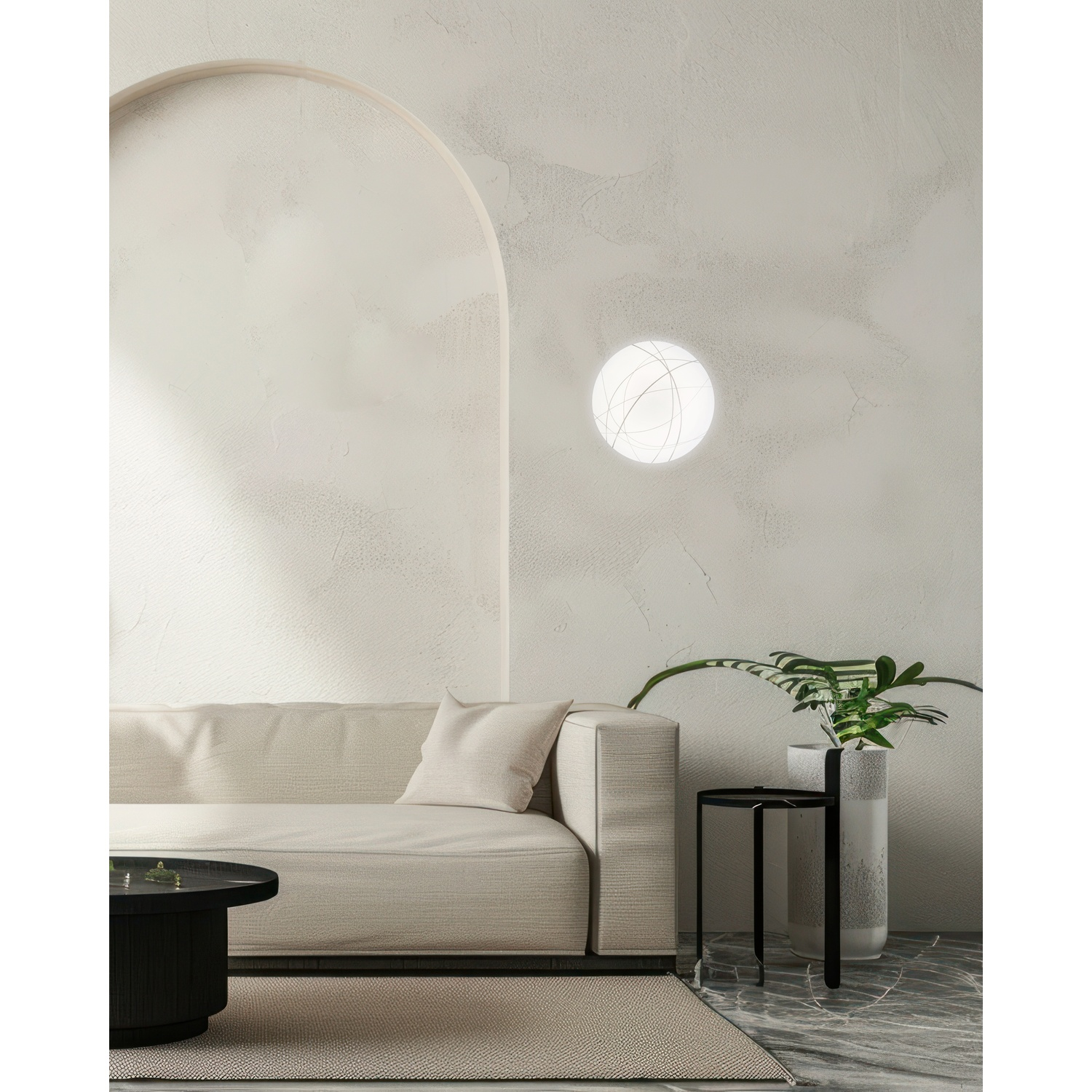 Design d'interni con un divano, un tavolino con pianta, un tavolo nero e un'illuminazione circolare.