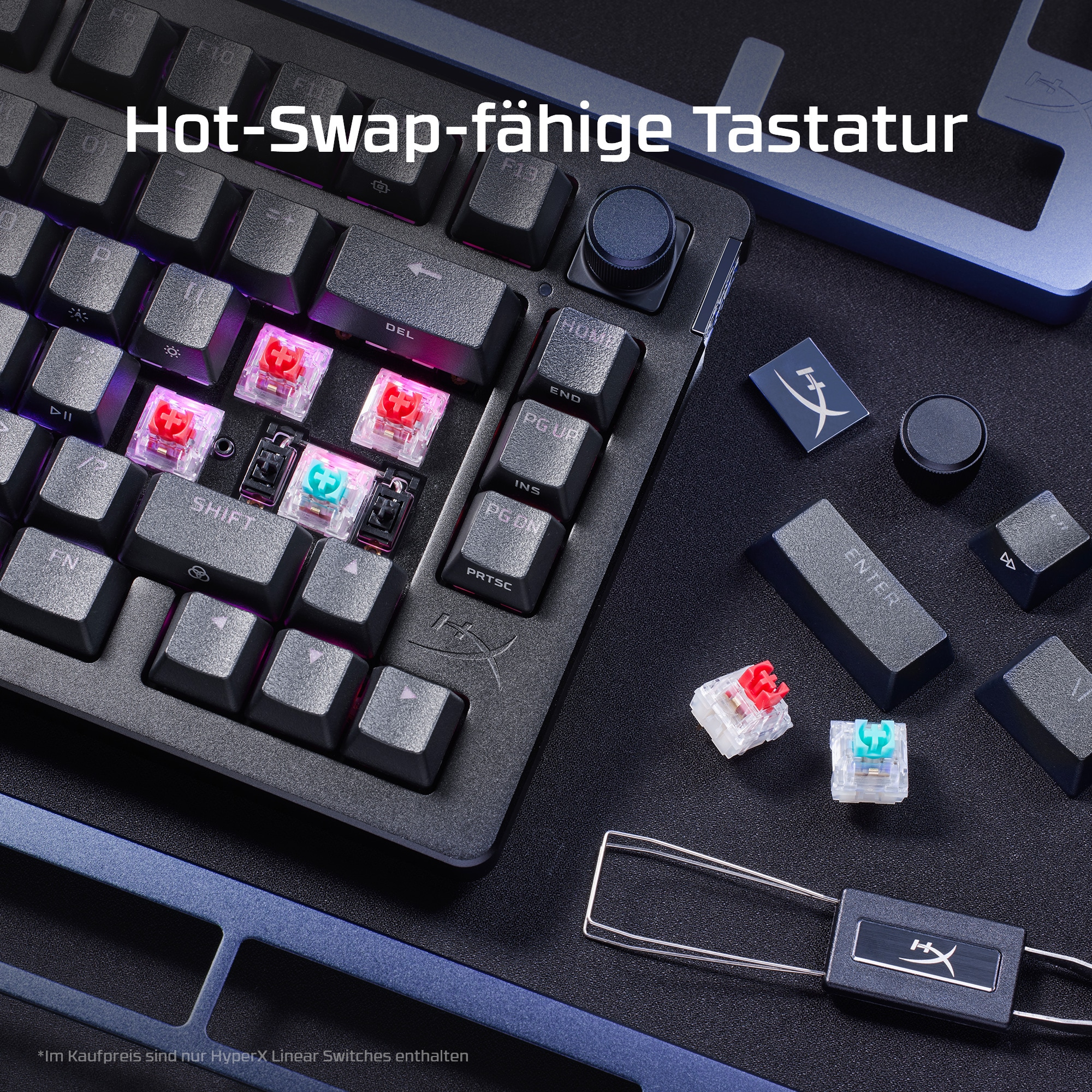 Schwarze Tastatur mit entfernten Tasten, farbige Schalter sichtbar. Schwarze und blaue Oberfläche.