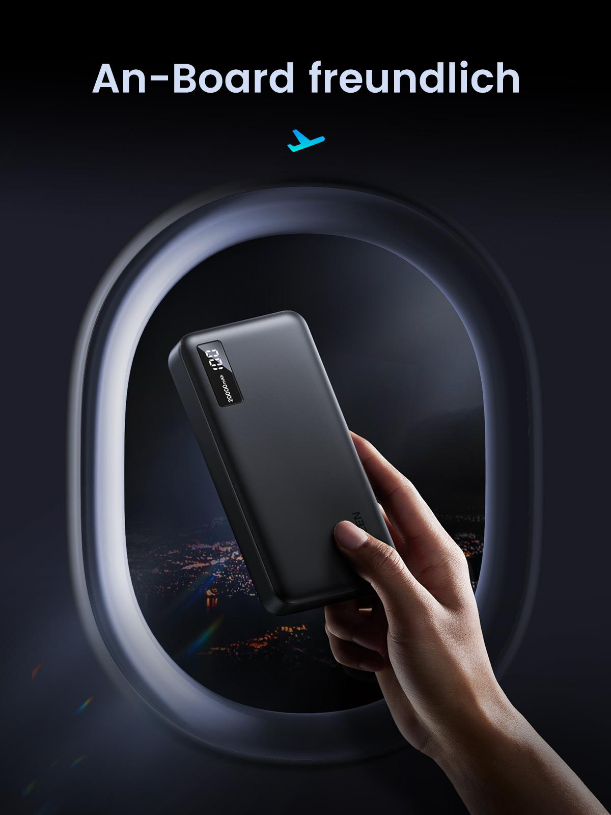 Hand hält Powerbank im Flugzeugfenster, im Inneren der Kabine.