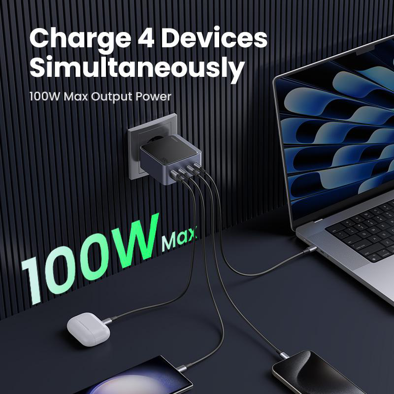 Ein Netzteil mit mehreren USB-Anschlüssen lädt einen Laptop, ein Telefon und Ohrhörer.