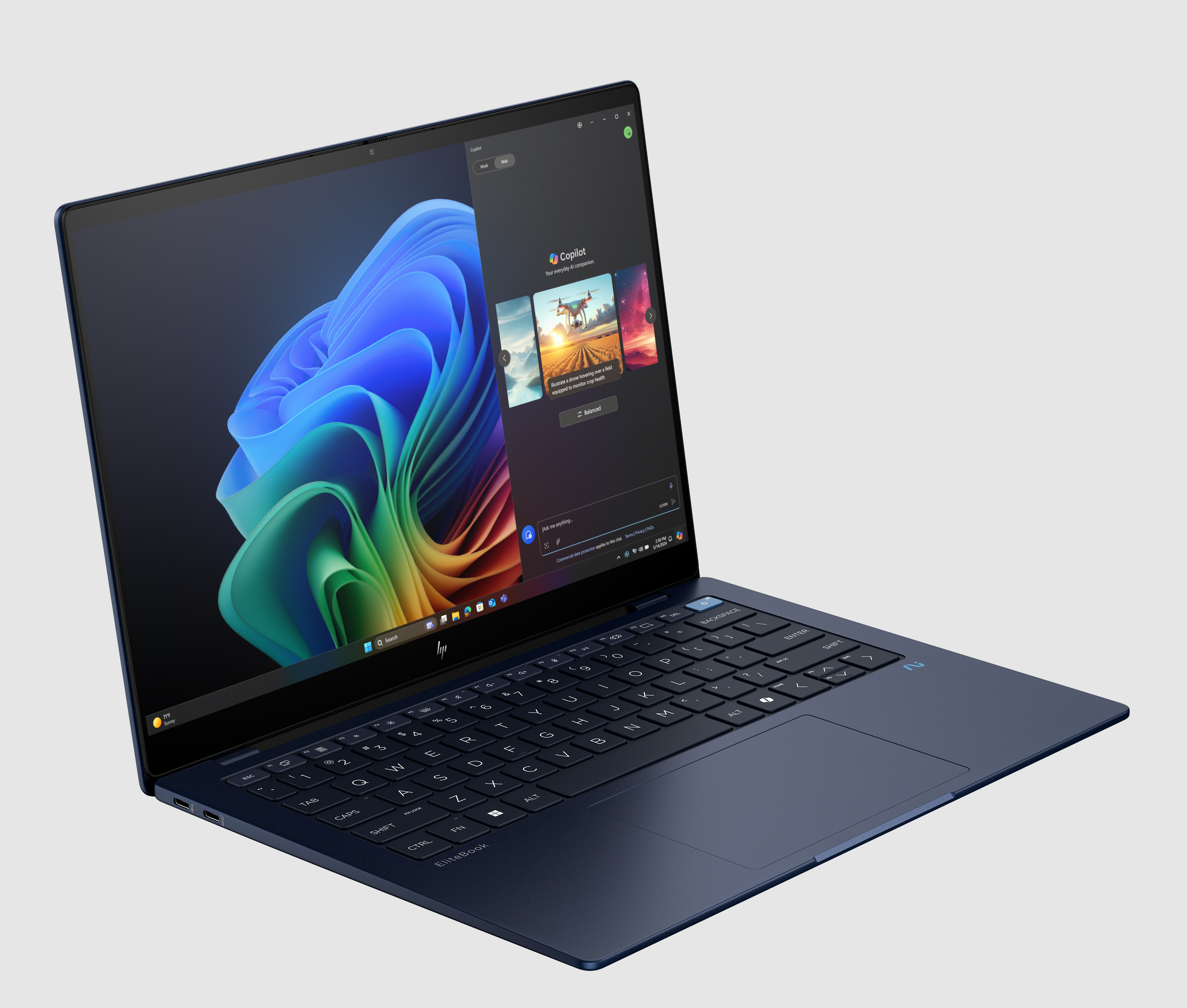 Una laptop azul oscuro muestra una aplicación con múltiples imágenes.