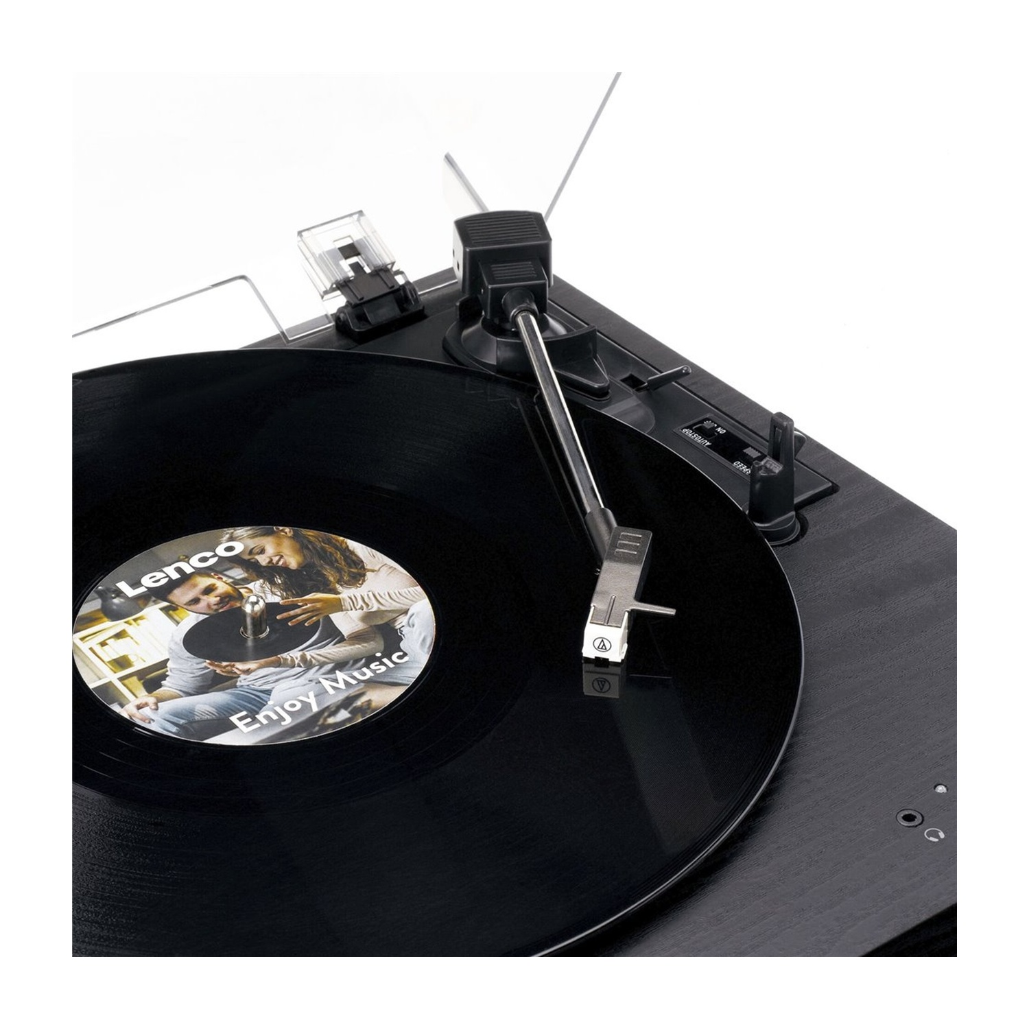 Giradischi con disco in vinile nero in riproduzione. Braccio, etichetta Lenco visibile. Superficie nera.