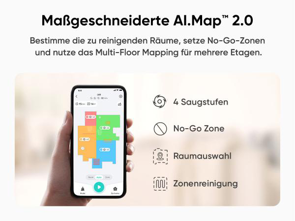 Eine Hand hält ein Telefon mit einer Raumkarte. Farblich codierte Zonen und Optionen für Reinigung und No-Go-Zonen.