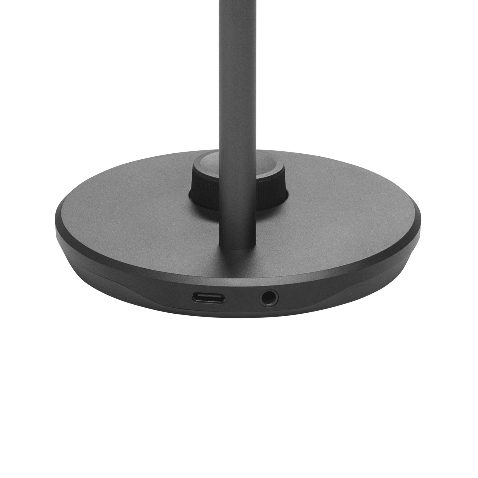 Ön tarafında bir USB ve ses bağlantı noktası bulunan koyu gri bir masa lambasının tabanı.