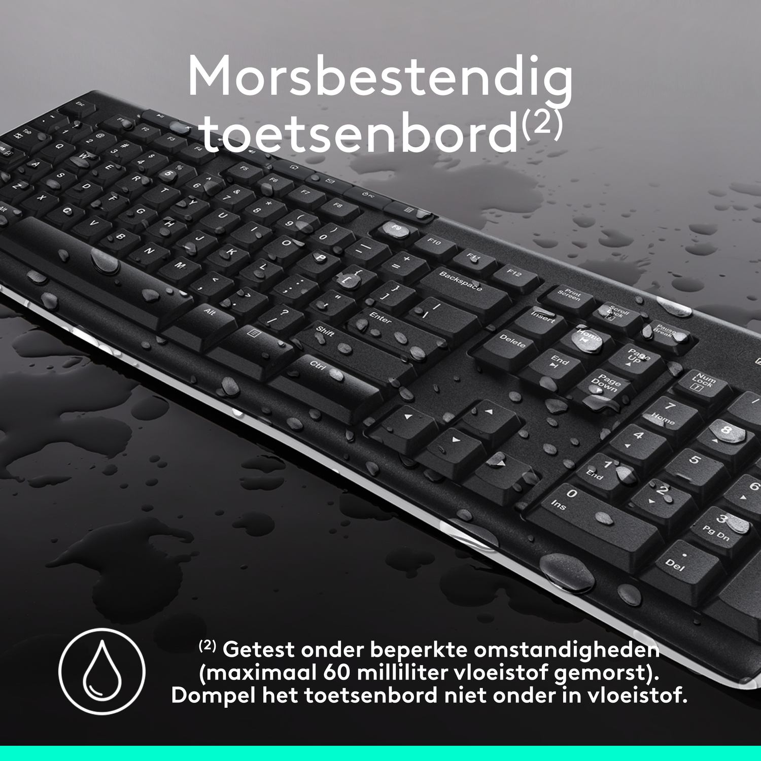 Black keyboard with water droplets on it. 