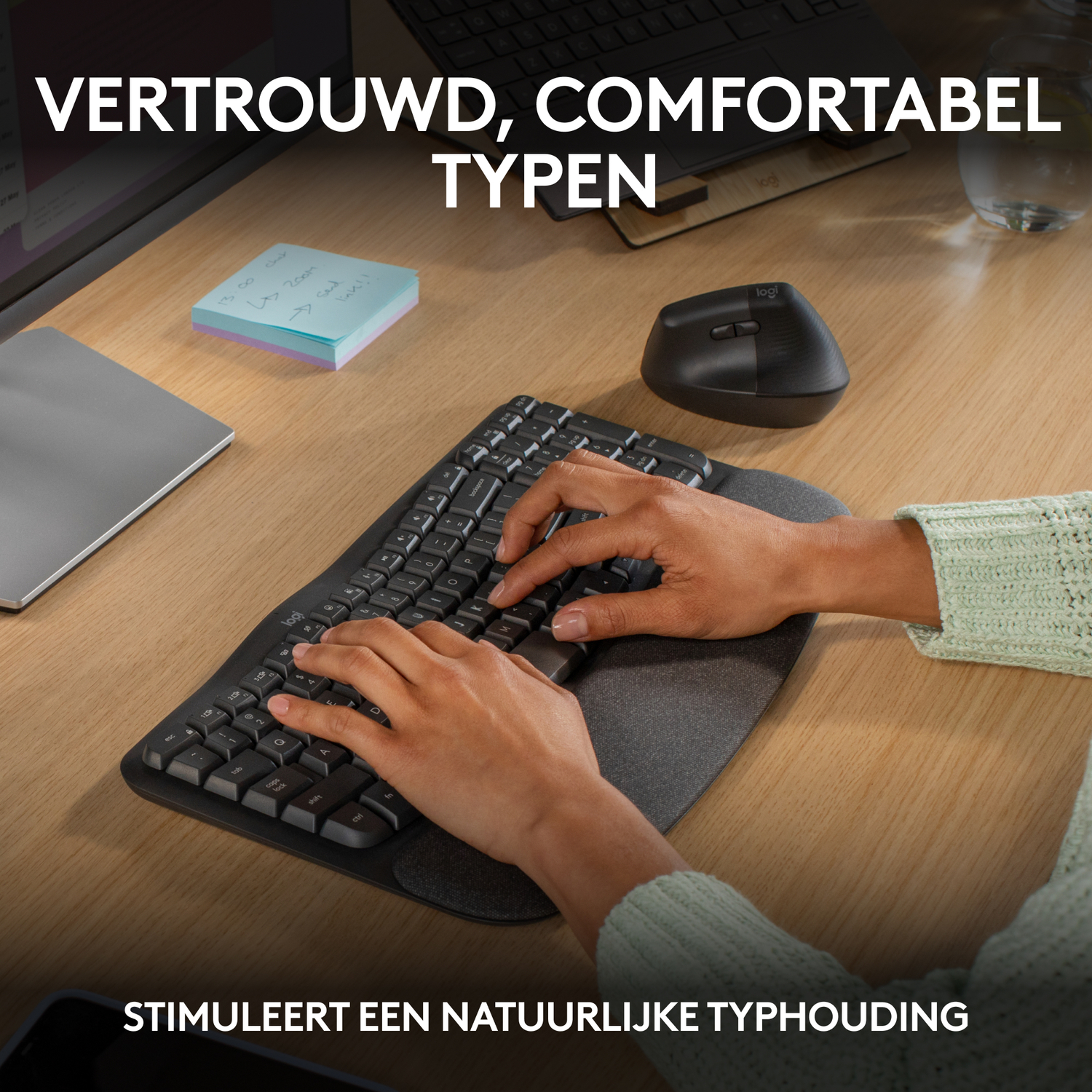 Person's hands on a keyboard with a wrist rest, with text above and below.