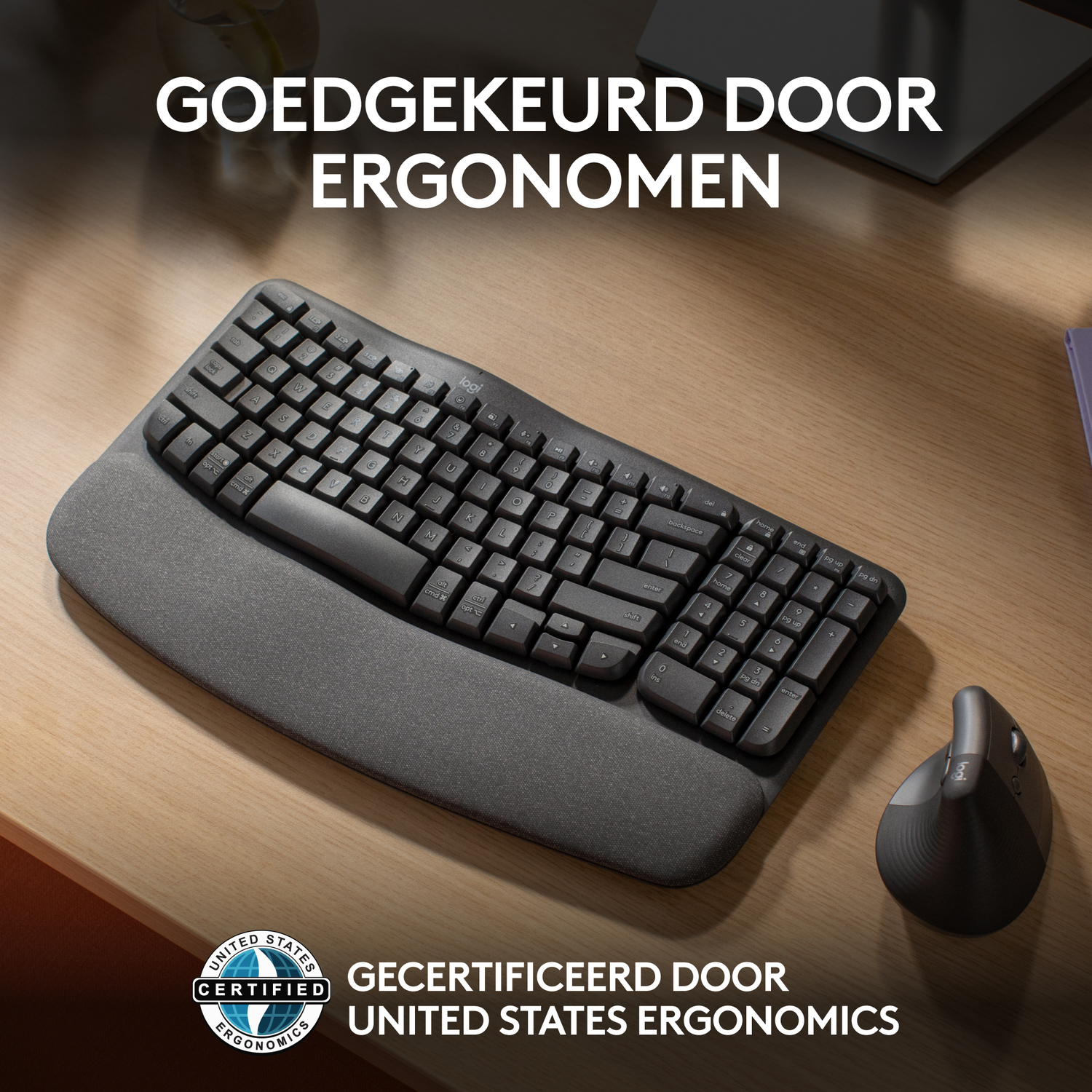 Black keyboard on a wooden desk next to a mouse and a pad.