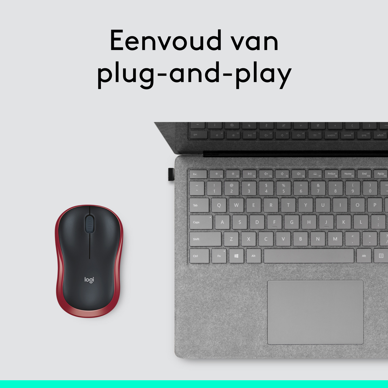 A red and black mouse with a laptop keyboard.