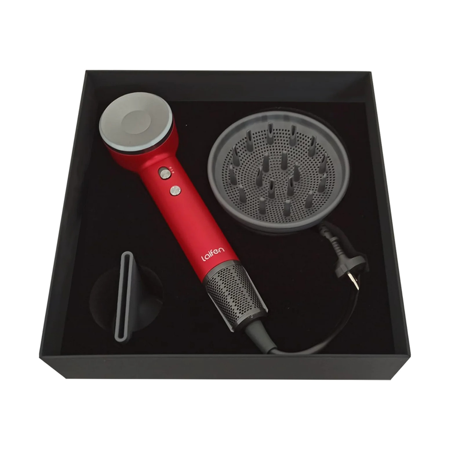 Asciugacapelli rosso con accessori in una scatola nera. Include un diffusore e un beccuccio.