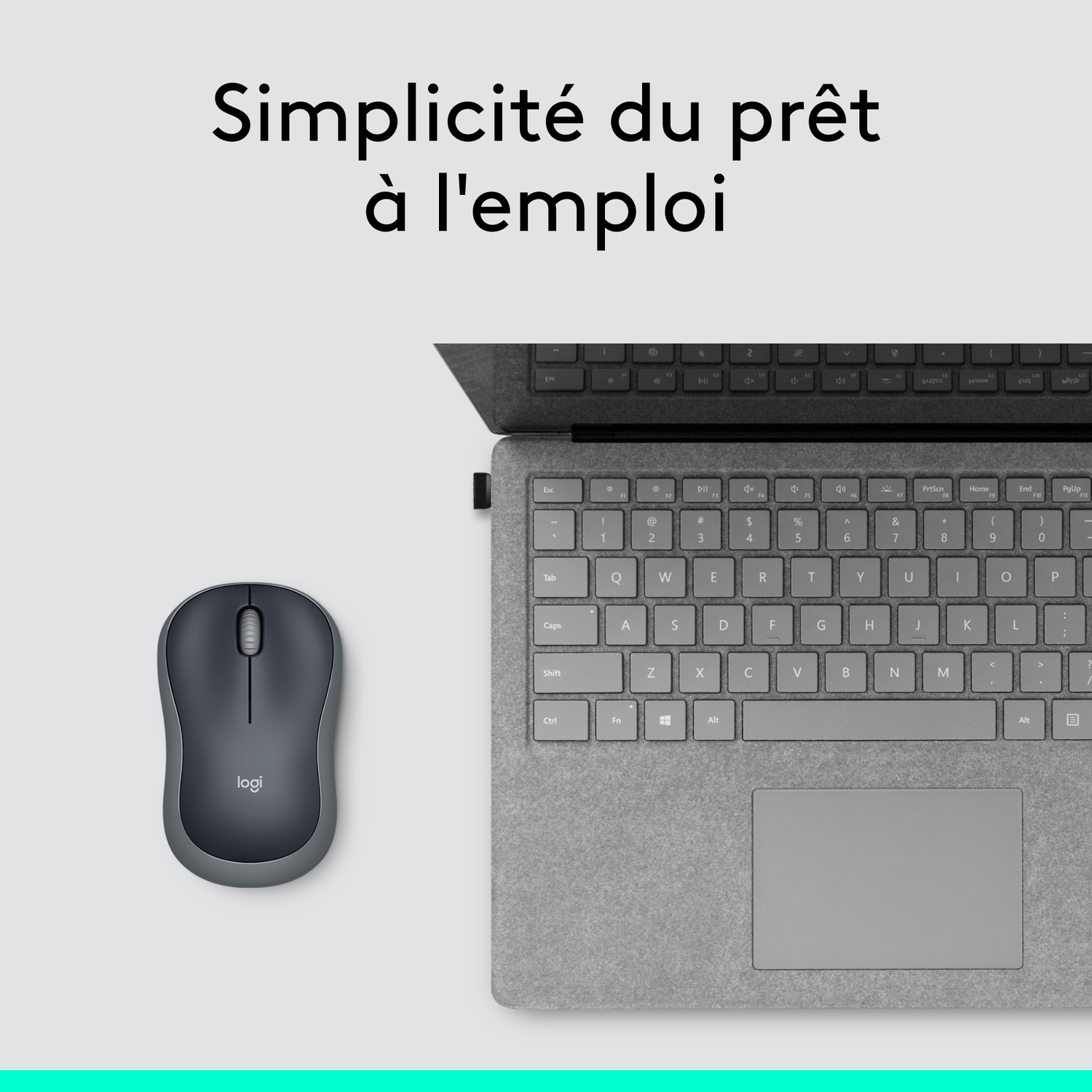 Une souris noire et un clavier d'ordinateur portable sur une surface grise. Le texte dit: Simplicité.