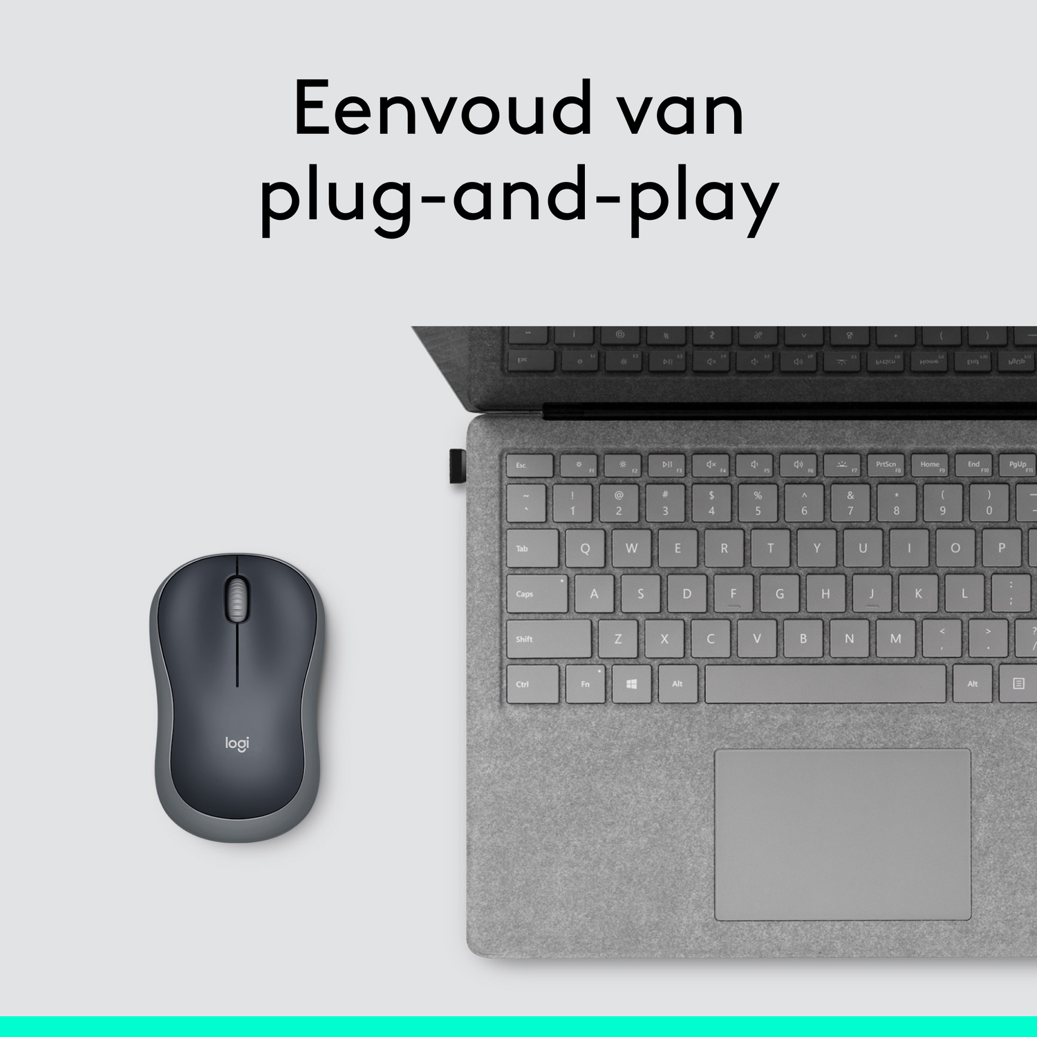 A gray wireless mouse and a gray laptop keyboard on a white surface with text above.