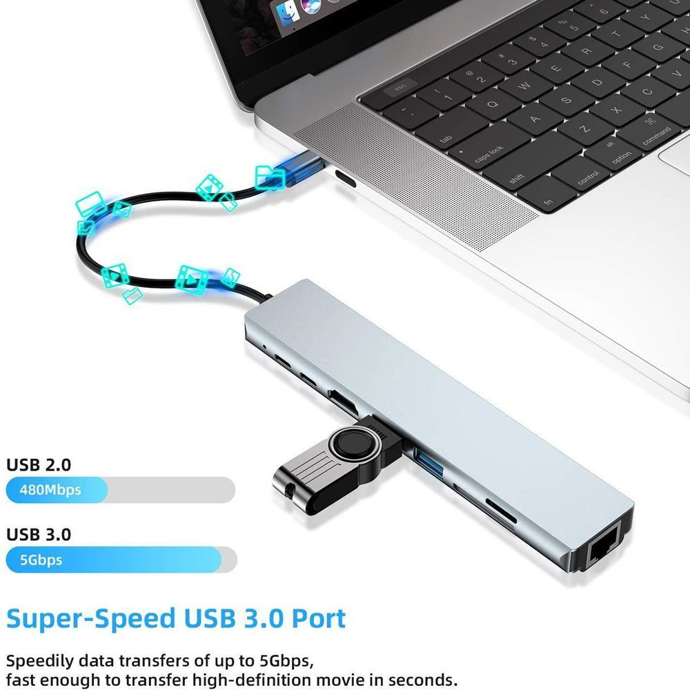 Bir dizüstü bilgisayara bağlı, USB 2.0 ve 3.0 hızları gösteren gümüş bir USB hub.