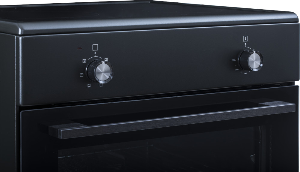 Black oven, close-up of knobs and handle.