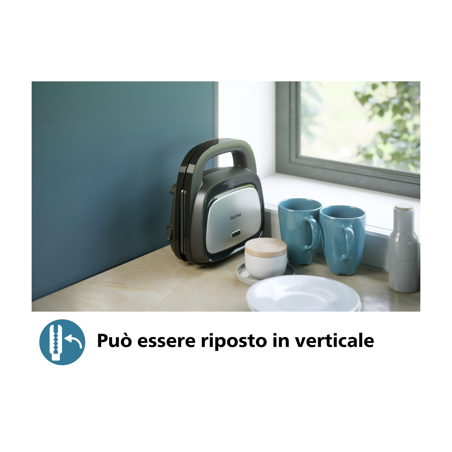 Una macchina per sandwich è appoggiata su un bancone. Due tazze blu, un piatto e una bottiglia sono anche sul bancone.