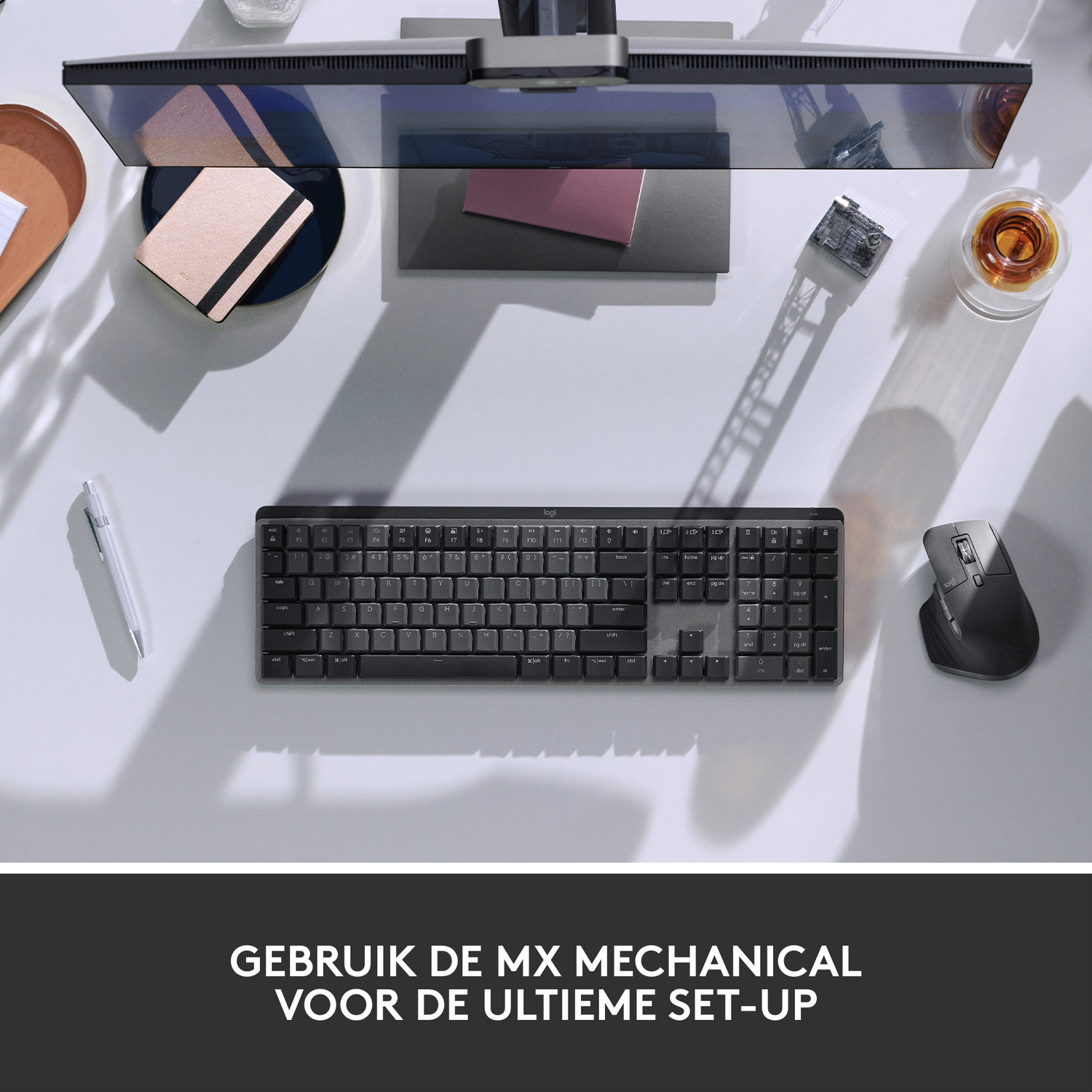 Overhead view of setup: keyboard, mouse, monitor, and desk items.
